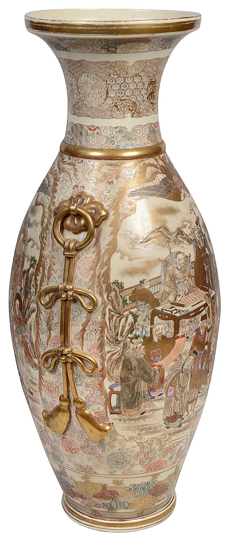 A fine quality late 19th Century Meiji period (1868-1912) Japanese Satsuma vase, with wonderful gilded decoration, depicting various scholars, tradesman and courtiers. Ring-drop handles to either side with rope tied bows.

Batch 75 61799. ANKZ
