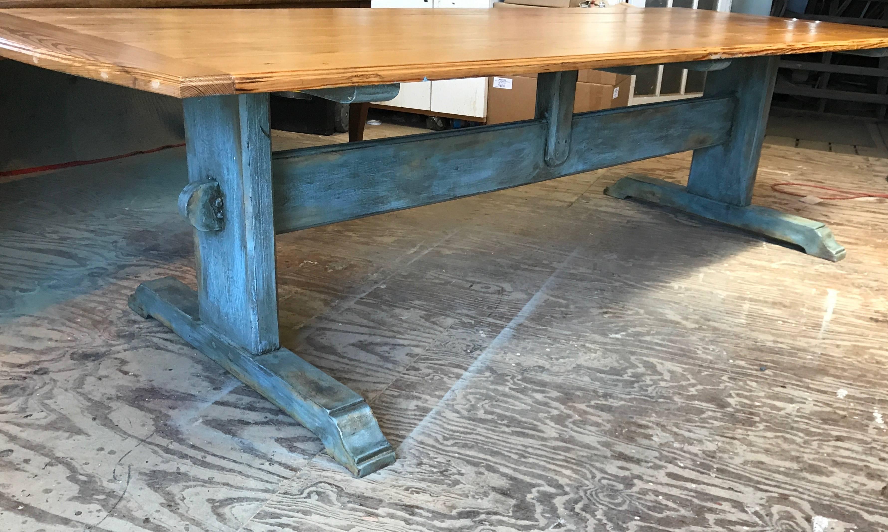 Large 19th century Scandinavian pine dining table with blue painted trestle and molded top that has rounded cleated ends. Scandinavian “Scots” pine with a rich golden color, figured grain, and good patination. A substantial shaped and molded trestle