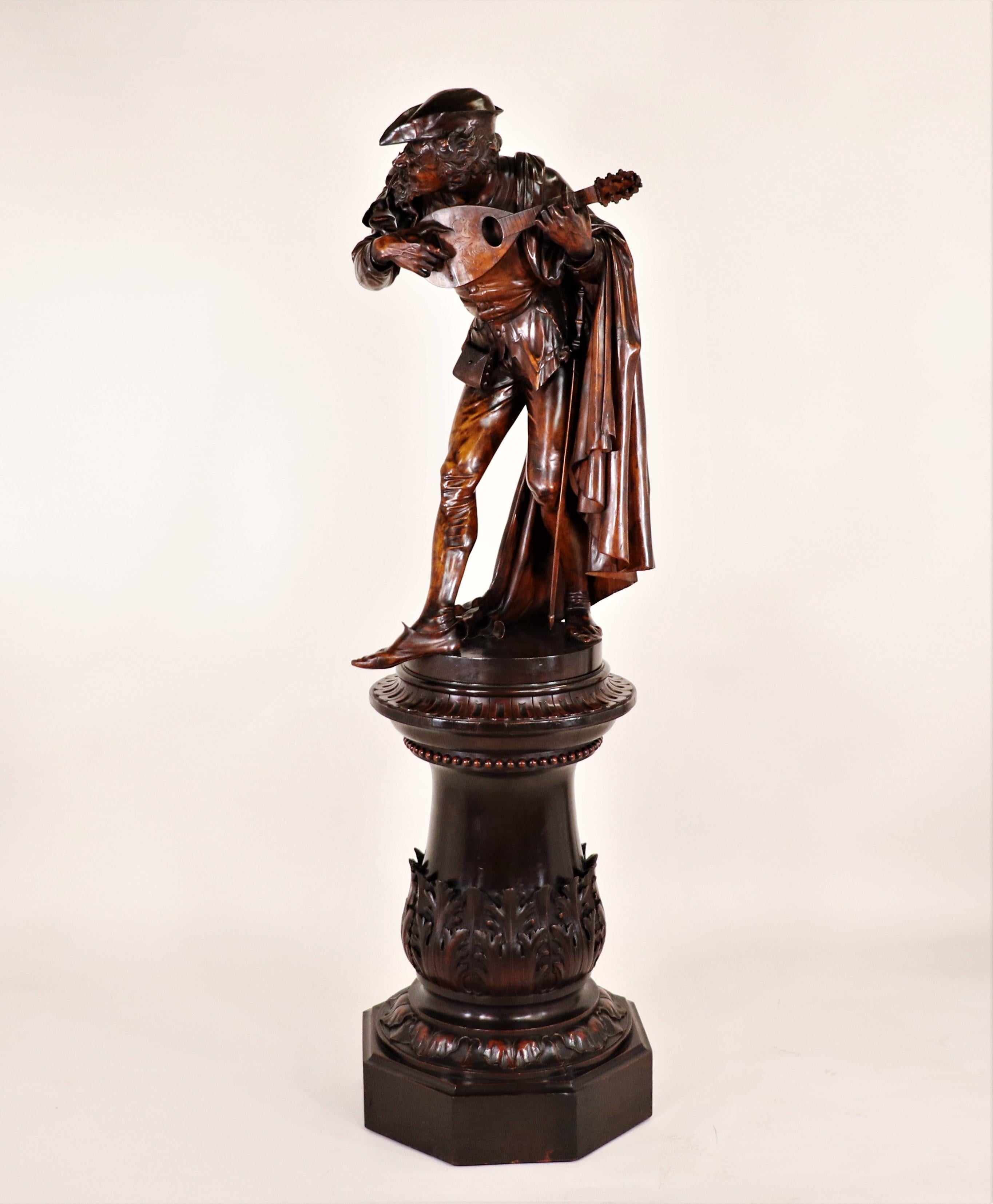 This outstanding 19th-century Italian carved lime wood sculpture of a bearded troubadour playing the mandolin was carved by the famous Italian woodcarver, Valentino Panciera Besarel (1829-1902). Valentino Panciera Besarel. was born in the province