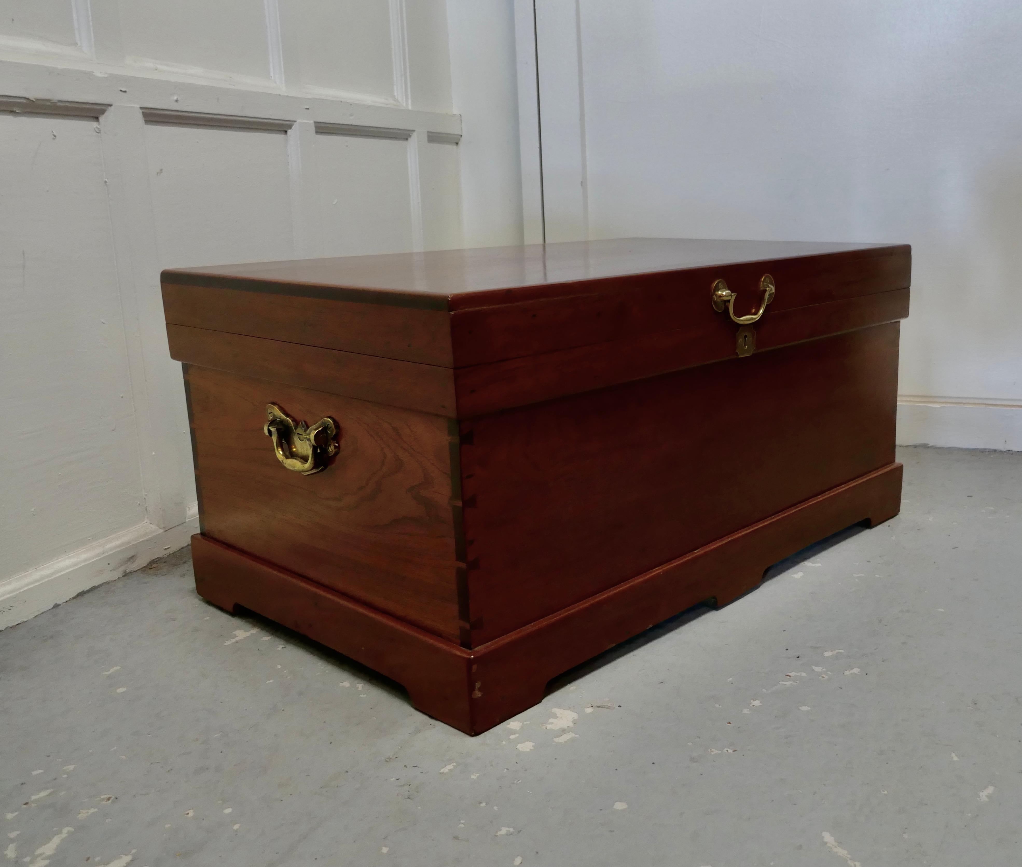 Large 19th century sea chest with. Brass handles, coffee table

This is a beautiful looking and fine quality Campaign chest
The chest stands on a sturdy plinth that runs around the whole off the base, it has brass carrying handles, it also has