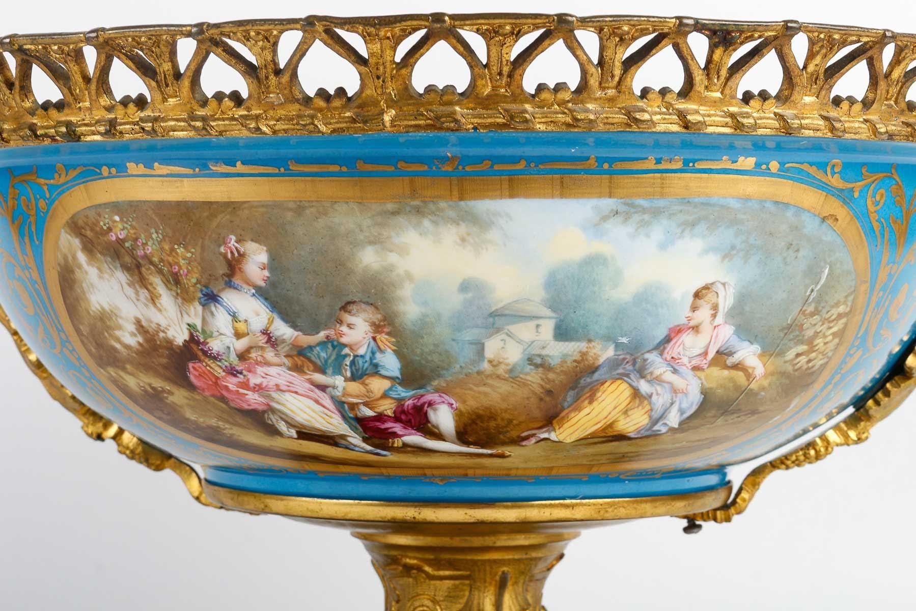 Large 19th century Sèvres porcelain bowl, Napoleon III period.

Large Sèvres porcelain bowl, 19th century, Napoleon III period, gilt bronze mounting, lovely decoration of gallant scenes and flowery interior.  

H: 31.5cm, W: 51cm, D: 39cm