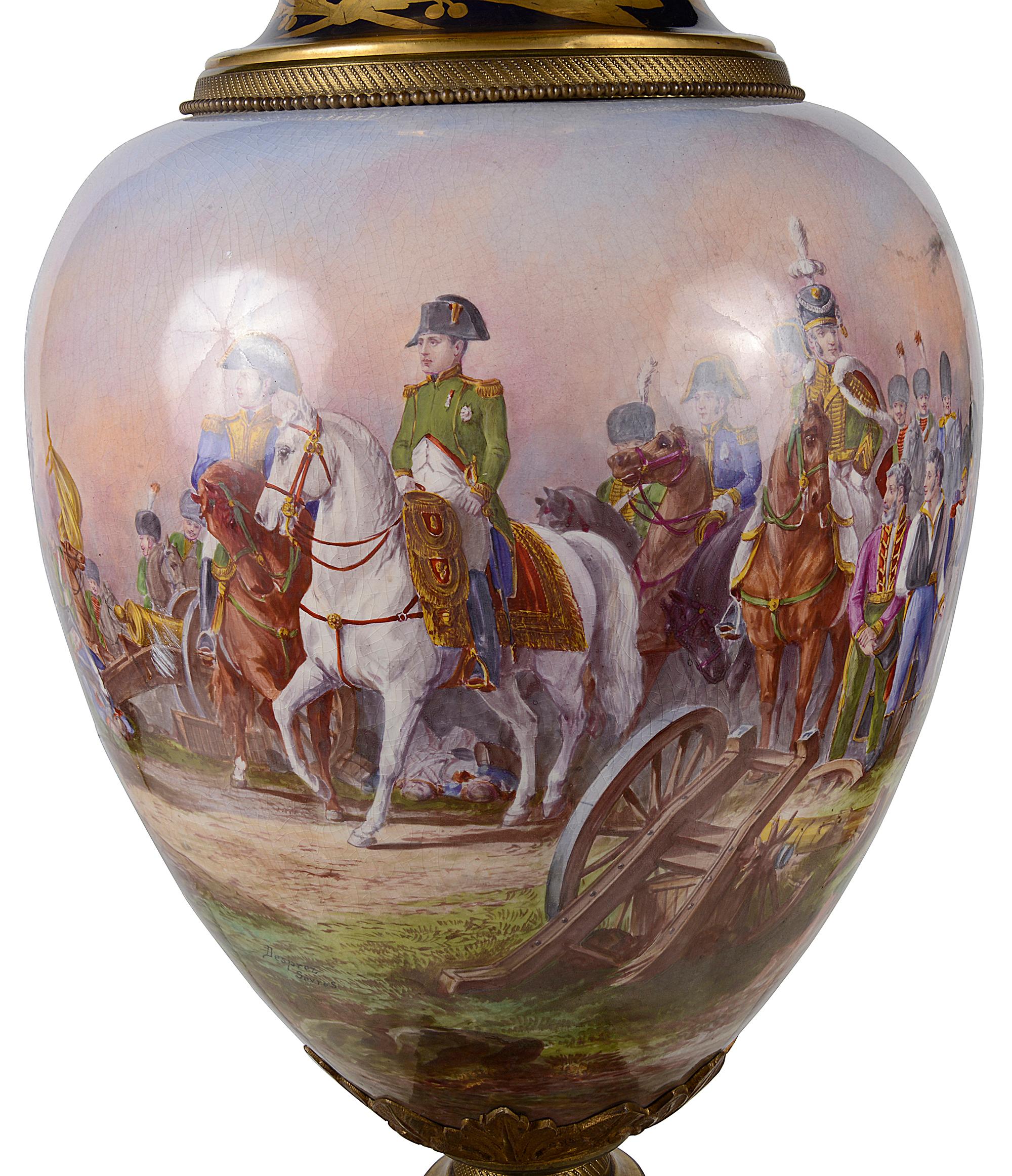 A wonderfully impressive late 19th century French Sevres style porcelain lidded vase, Cobalt blue ground with classical gilded motif decoration. Gilded ormolu finial, moulding and base. 
A wonderful hand painted scene of Napoleon on horse back in