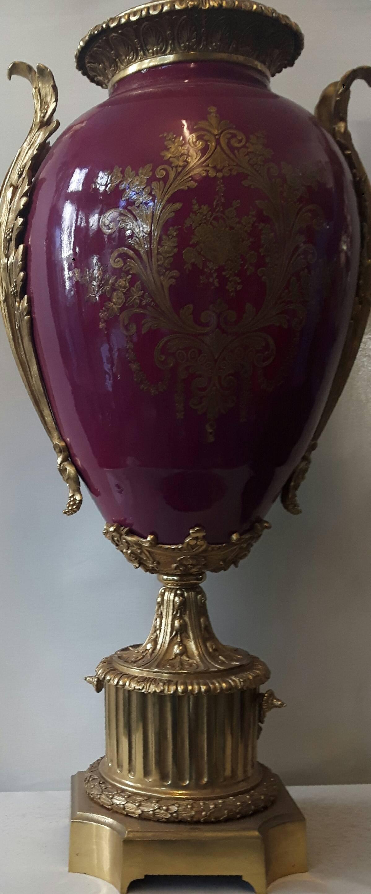 A lovely Sèvres -style porcelain and ormolu vase on a burgundy red background, the front is hand-painted with a mythological scene of Venus whilst the back of the vase is elaborately gilded,
French, circa 1880.