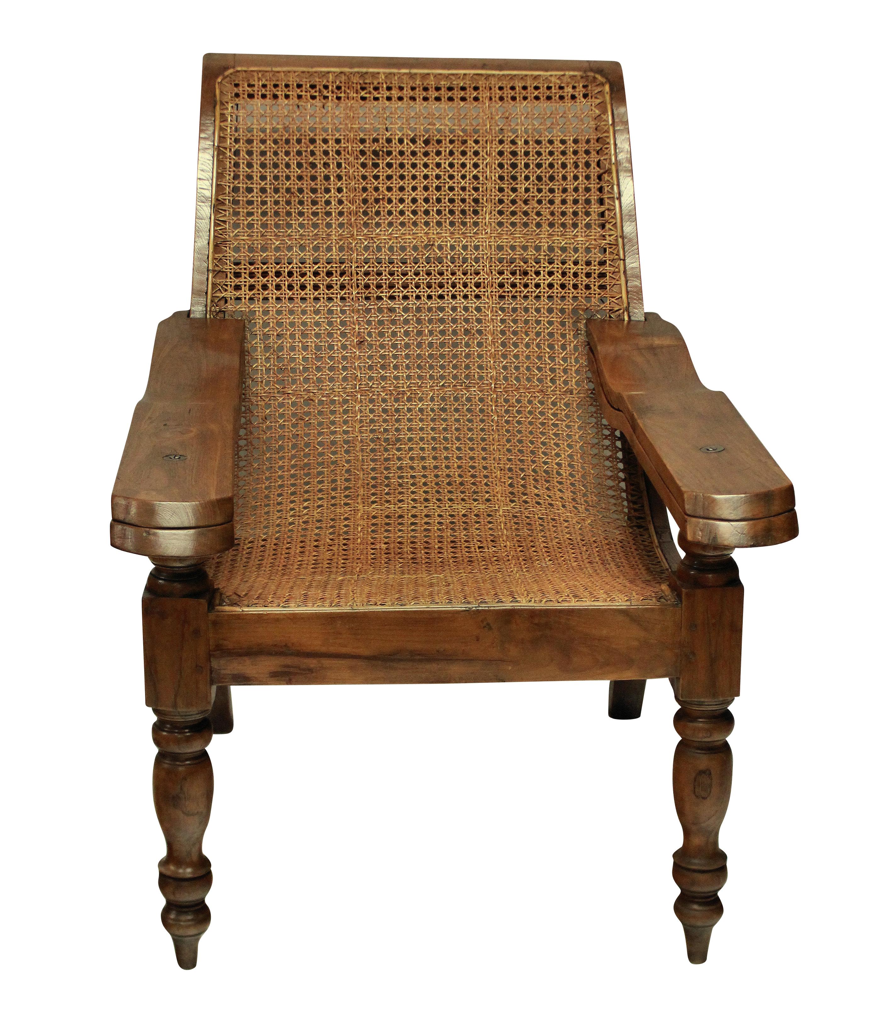 A large colonial, solid teak plantation chair, beautifully restored and with its original cane work intact. With swing-out leg rests.

Measures: 97cm high (back) x 47cm high (seat) x 72cm wide x 115cm deep x 166cm deep (open).