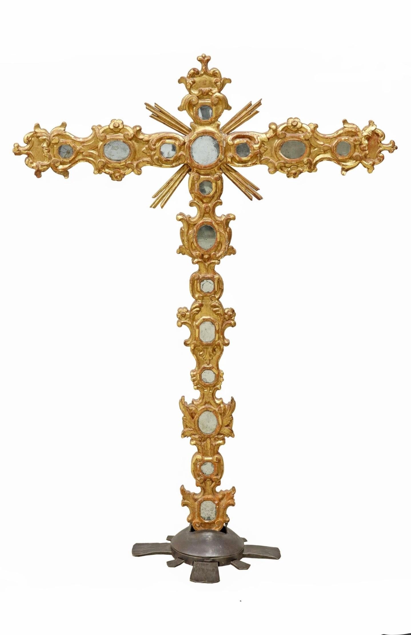 A magnificent monumental Spanish ecclesiastical hand carved giltwood church processional / altar cross.

Spanish, 19th century, the most impressive religious antique in brilliant gilded wood, gesso and red bolle, double-sided, having scrolled