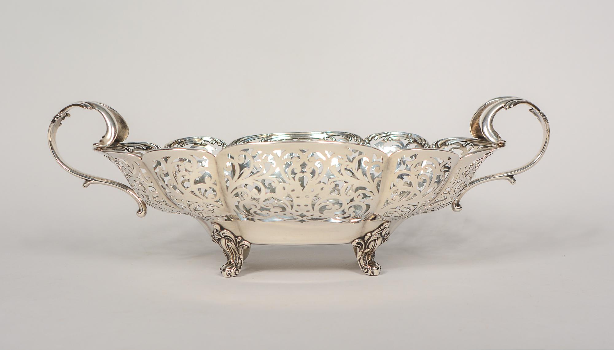 Large open work sterling bowl or basket by Providence, R. I. maker Howard Sterling Company. The Howard Sterling co. was in existence from 1878 to 1902. The company was known for exceptional work and this piece is an excellent example. This weighs
