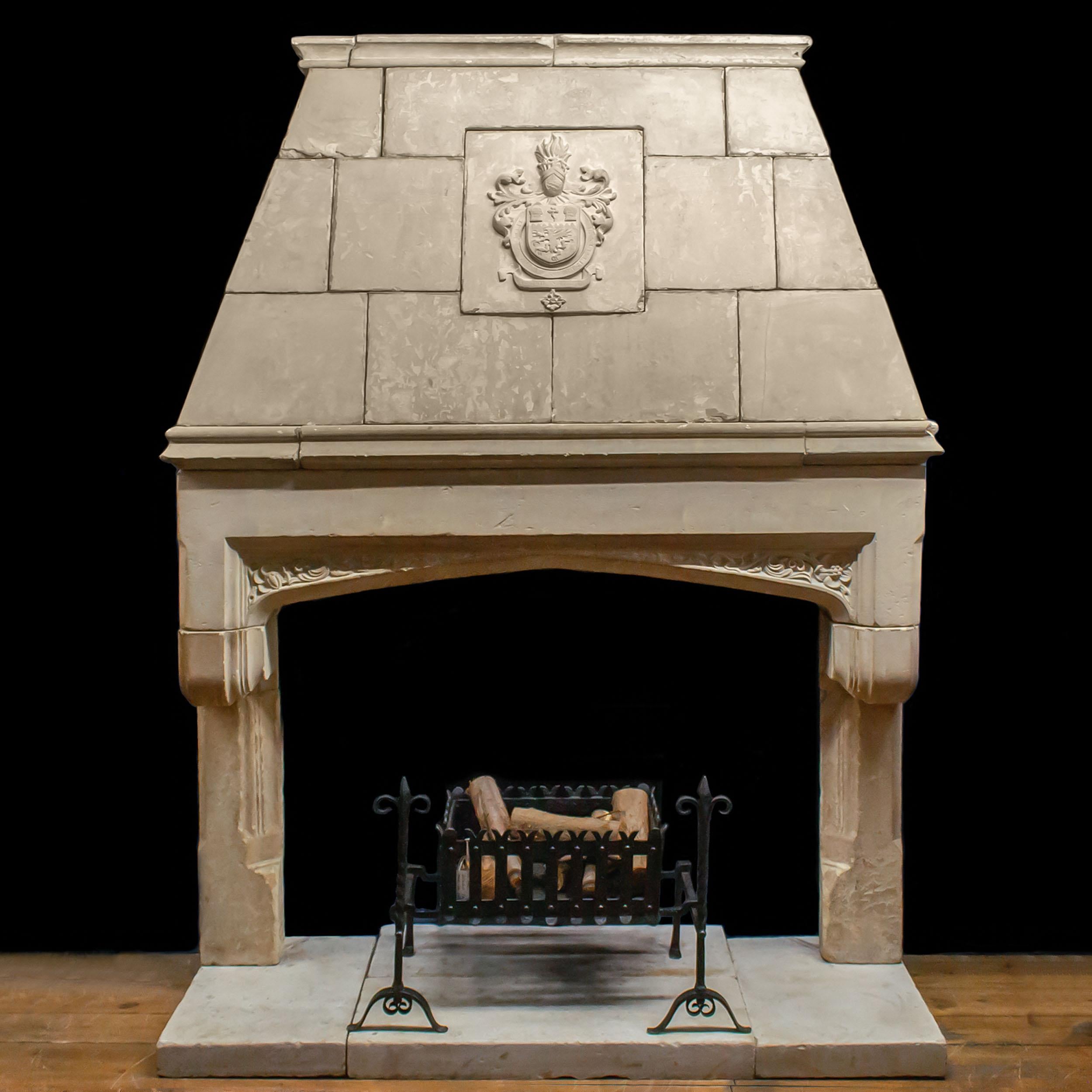 A grand and monumental early Victorian trumeau chimneypiece in the Renaissance Revival style. The blockwork trumeau is centred by an armorial and rests on a large freize carved with floral spandrels in the Tudor Revival style, over cantilevered,