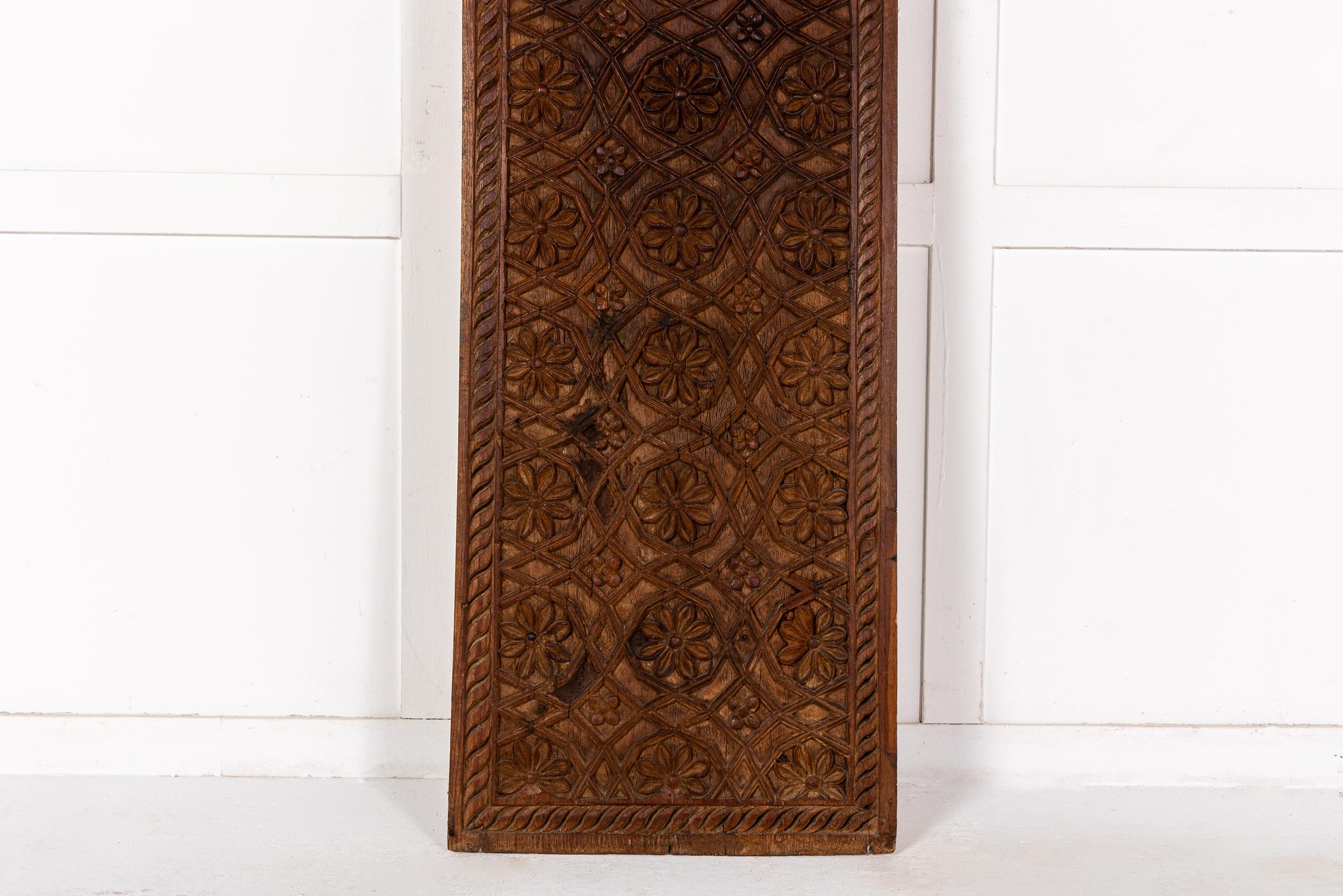 A Very Large 19th Century Carved Hardwood Panel, Probably Syrian.

The panel with all over carved floral and scrollwork decoration with a leafy gadrooned border. Of large size and in excellent condition, this piece shows carving of exceptionally