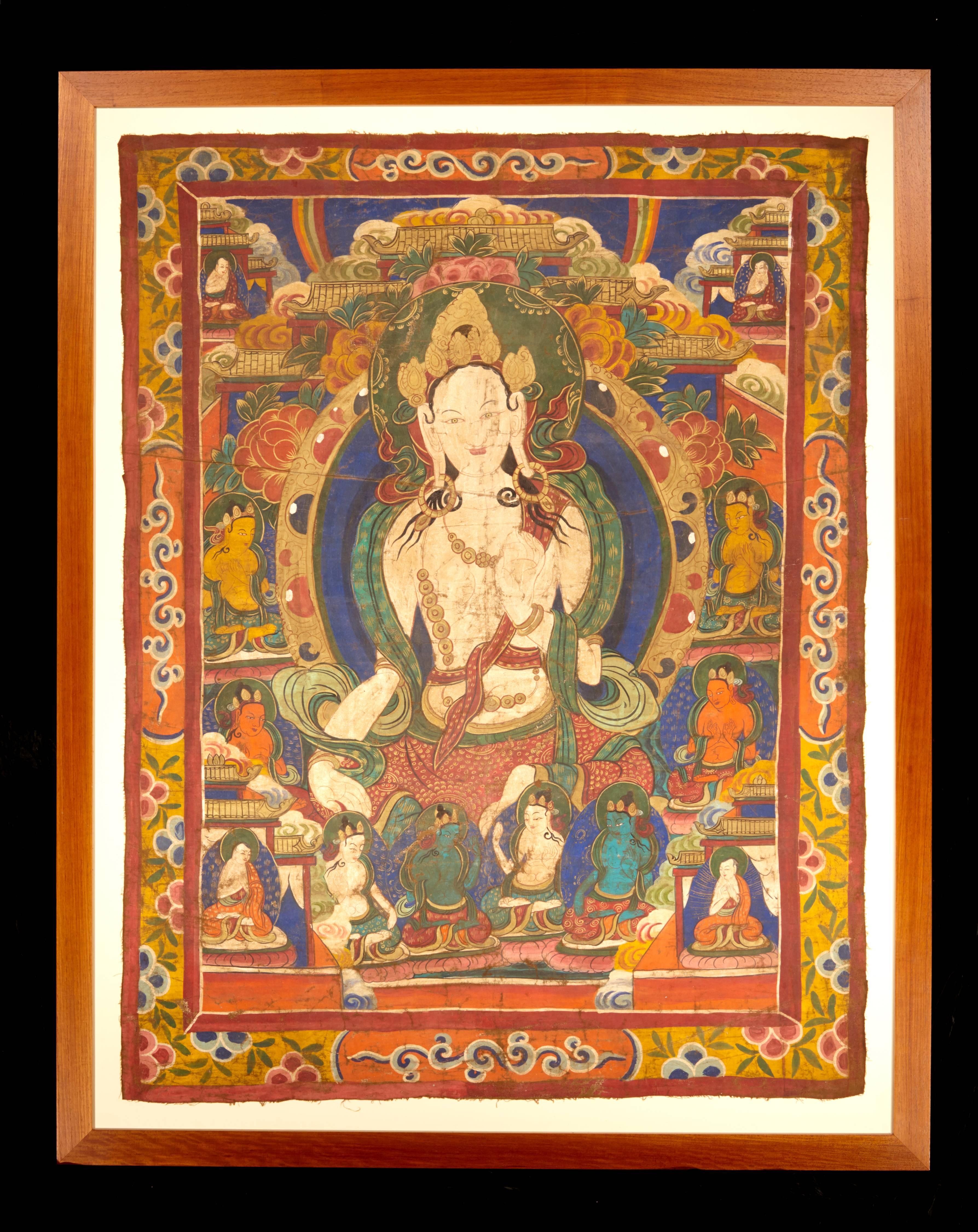 Large 19th century Tibetan Thangka of white tara seated in mudras surrounded by Bodhisattvas and Buddhas. This painting has very vibrant colors with great detail.  This spiritual and decorative Asian painting will be the focal point in any room.