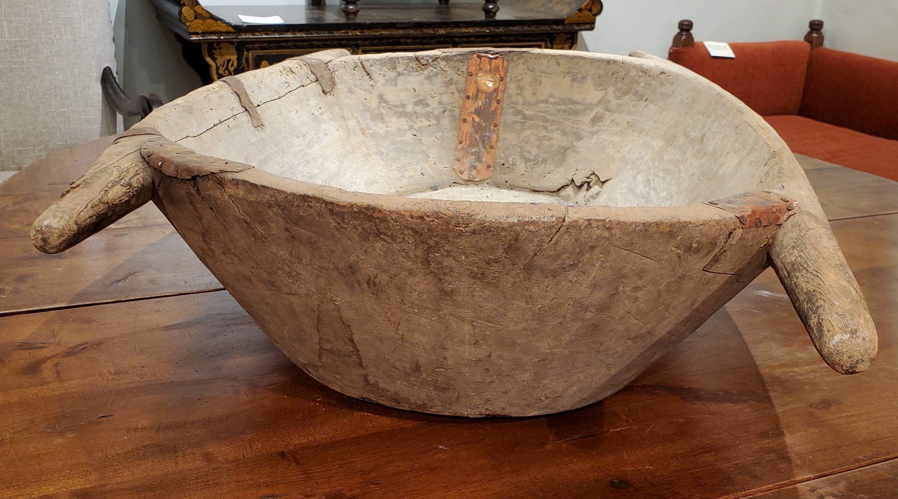 Unusually Large 19th Century Turkish Dough Bowl. Carved from one piece of wood with four handles. Used to kneed dough and let it rise Turkey, circa 1890.
Measures: 7” H 36” W 19.5” D