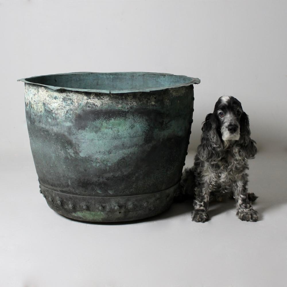 A wonderful, large copper, that can be used as a planter or log bin with the most beautiful and natural verdigris, that can only form over many years of exposure to the elements (not to be mistaken for the many coppers that you see which have a
