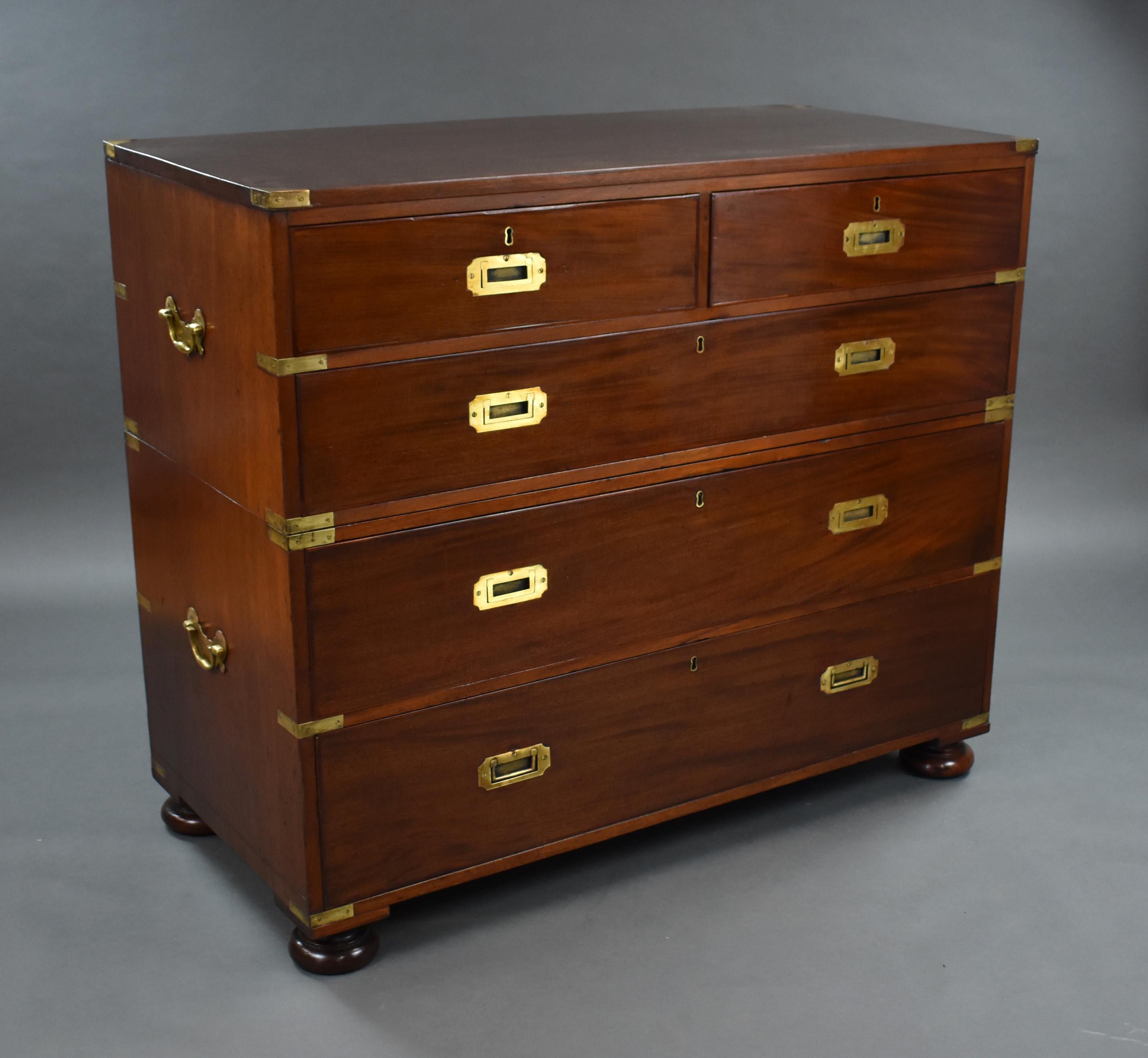 For sale is a good quality large Victorian mahogany campaign style chest of drawers. Having an arrangement of five drawers, each with military handles, the chest stands on bun feet and is in very good condition for its age. 

Measures: Width: