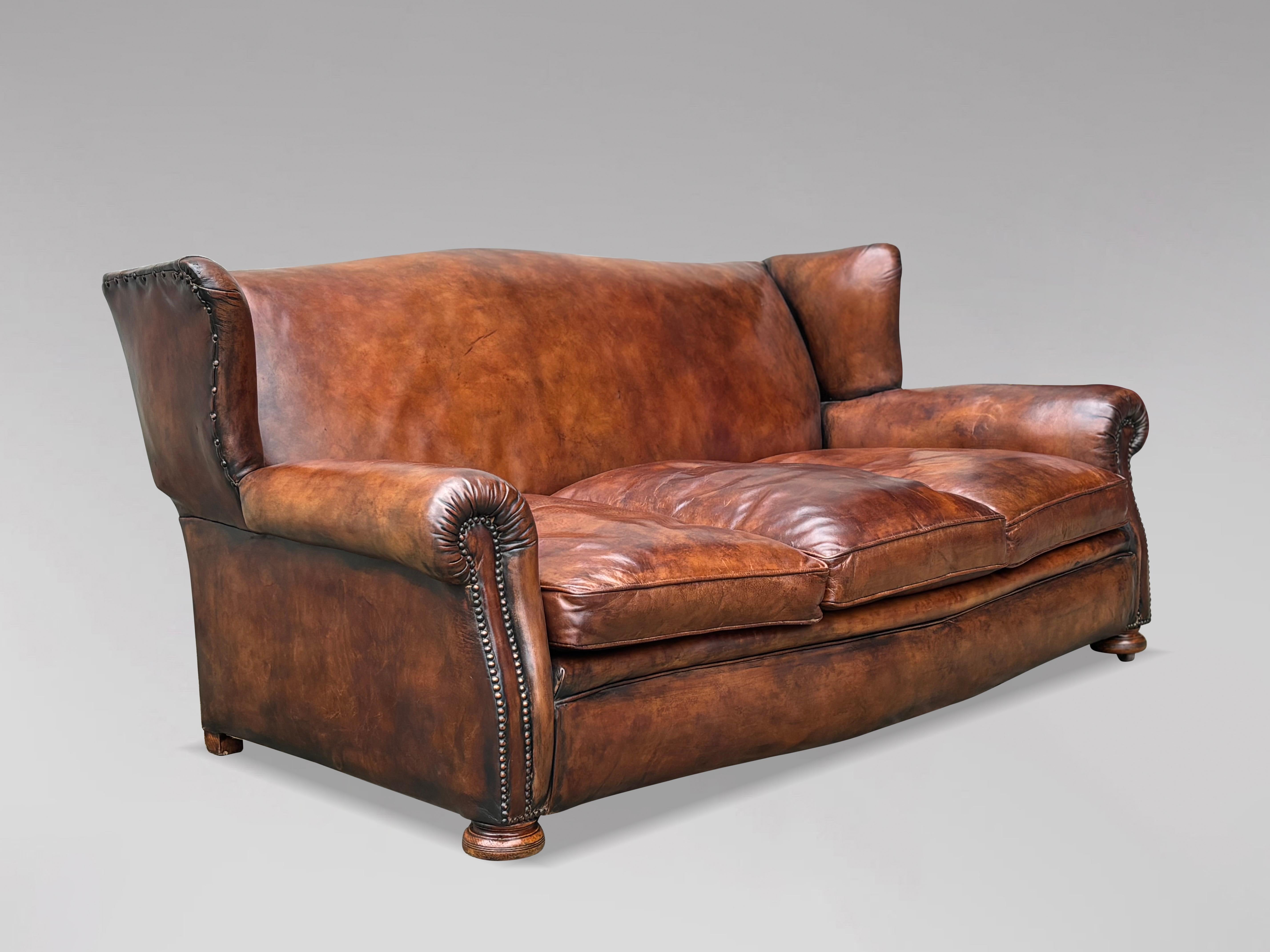 Large Three-Seater 19th Century Victorian Period Leather Sofa

A late 19th-century Victorian period hand-dyed leather wingback sofa. This sofa boasts a beautifully shaped back, flanked by two wings and curved arms, above three deep, feather-stuffed