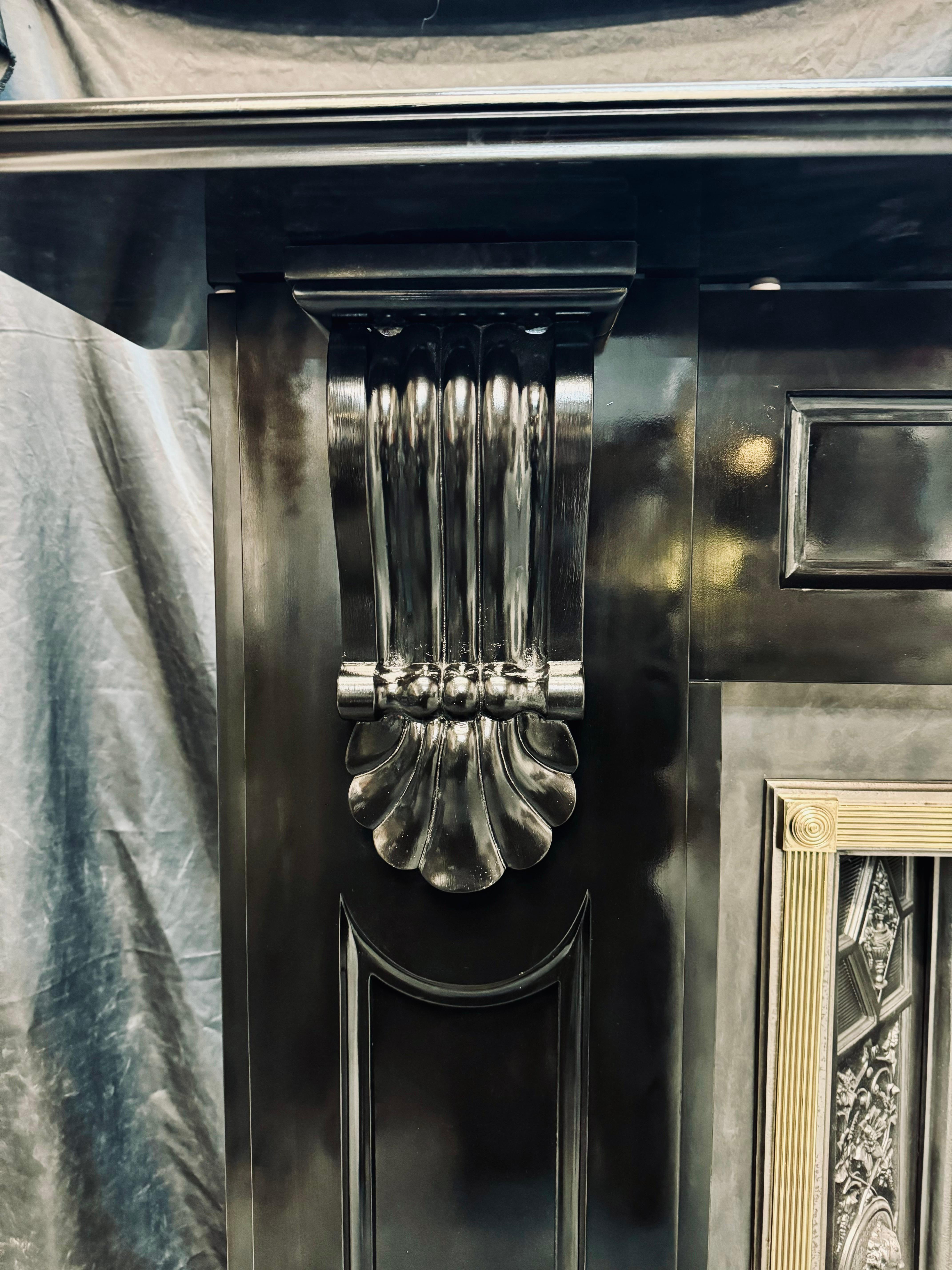 A large and grand 19th Century Victorian Scottish Ballachulish slate fireplace surround.
A generous top shelf with a moulded edge rests above a recessed panelled frieze the recessed edges with corvetto detail, this is in turn flanked by wide