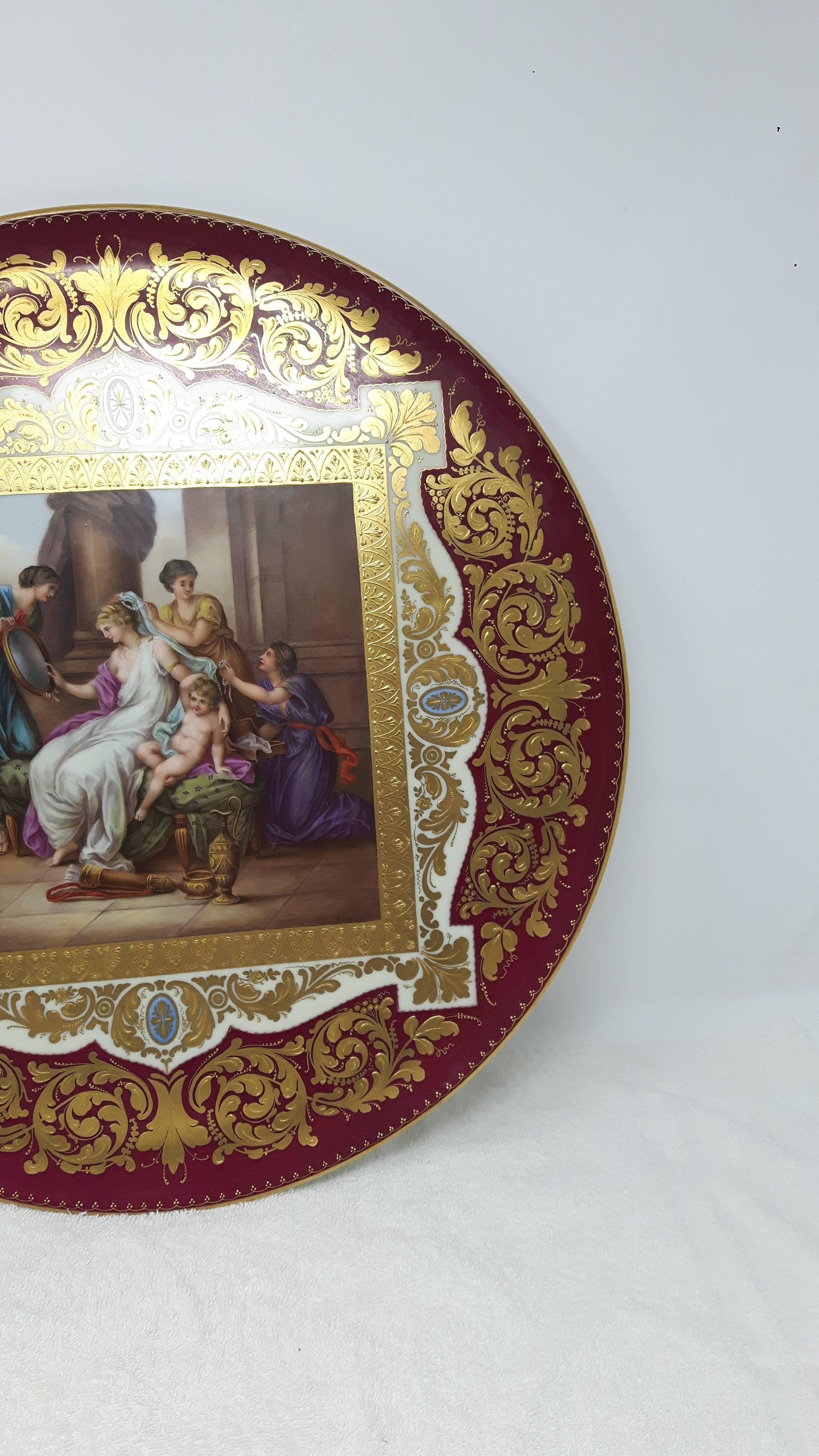 A glamorous Vienna style charger painted with a central panel of 