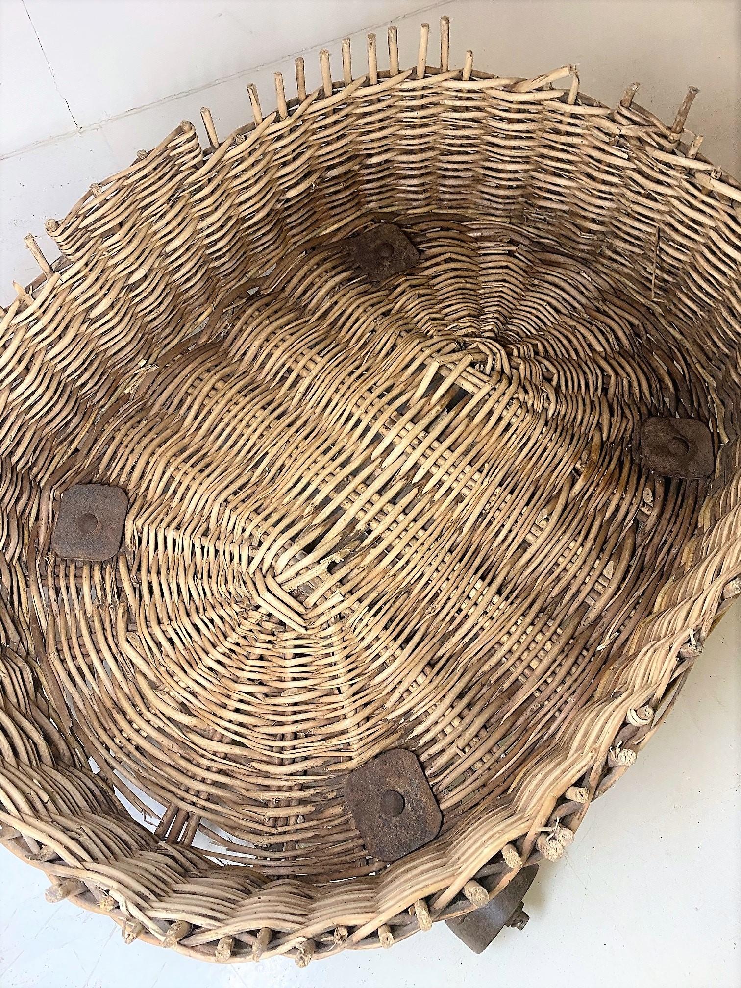 Large 19th Century Wicker Dog Bed Log Basket on Original Cast Iron Wheels For Sale 3
