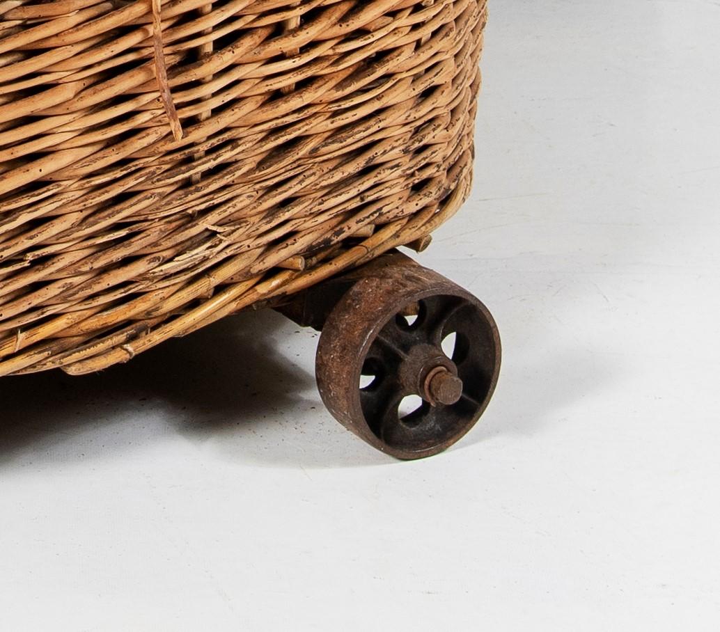 Early Victorian Large 19th Century Wicker Dog Bed Log Basket on Original Cast Iron Wheels For Sale