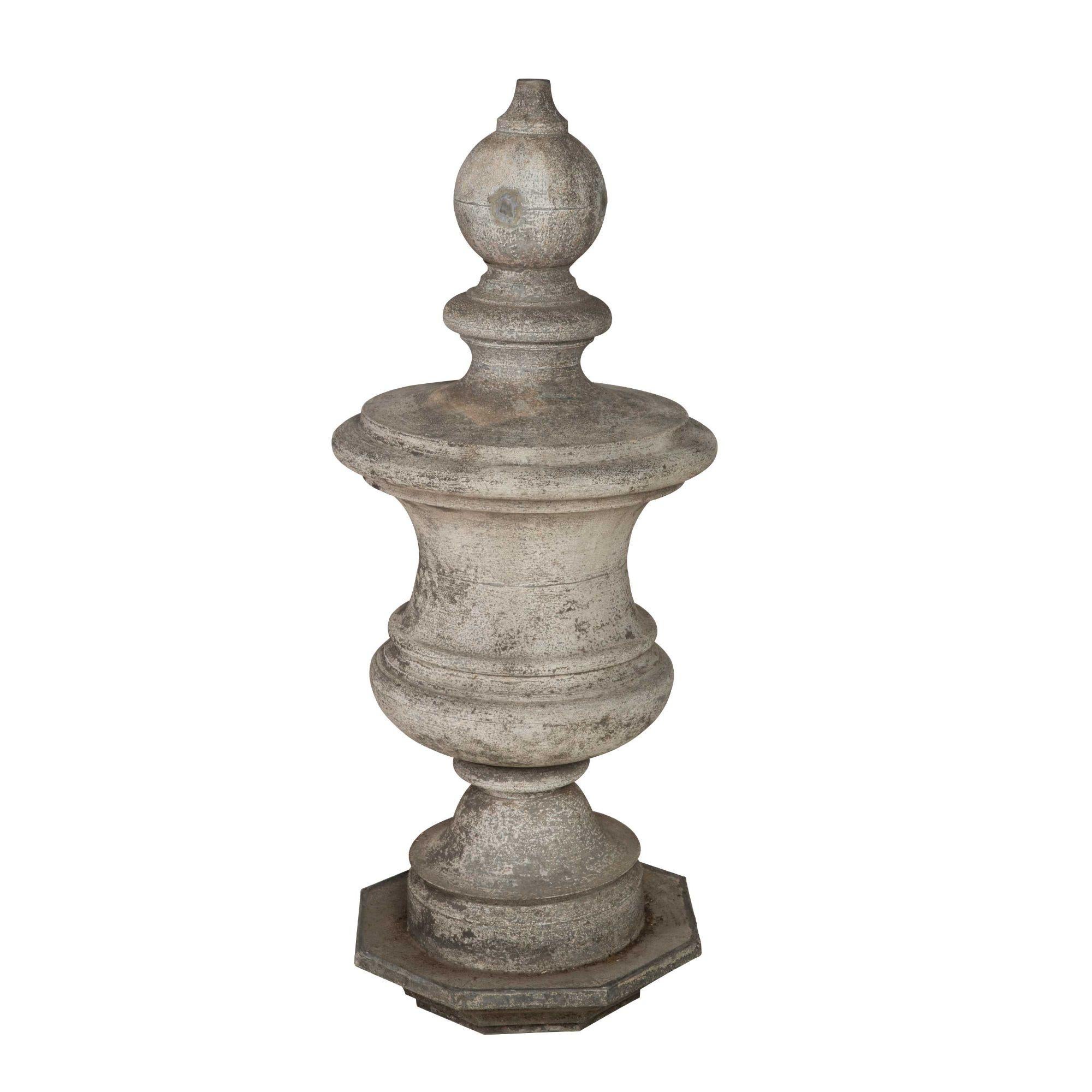 This large 19th century finial is made from zinc. This piece is finished with a good patina in a white color.