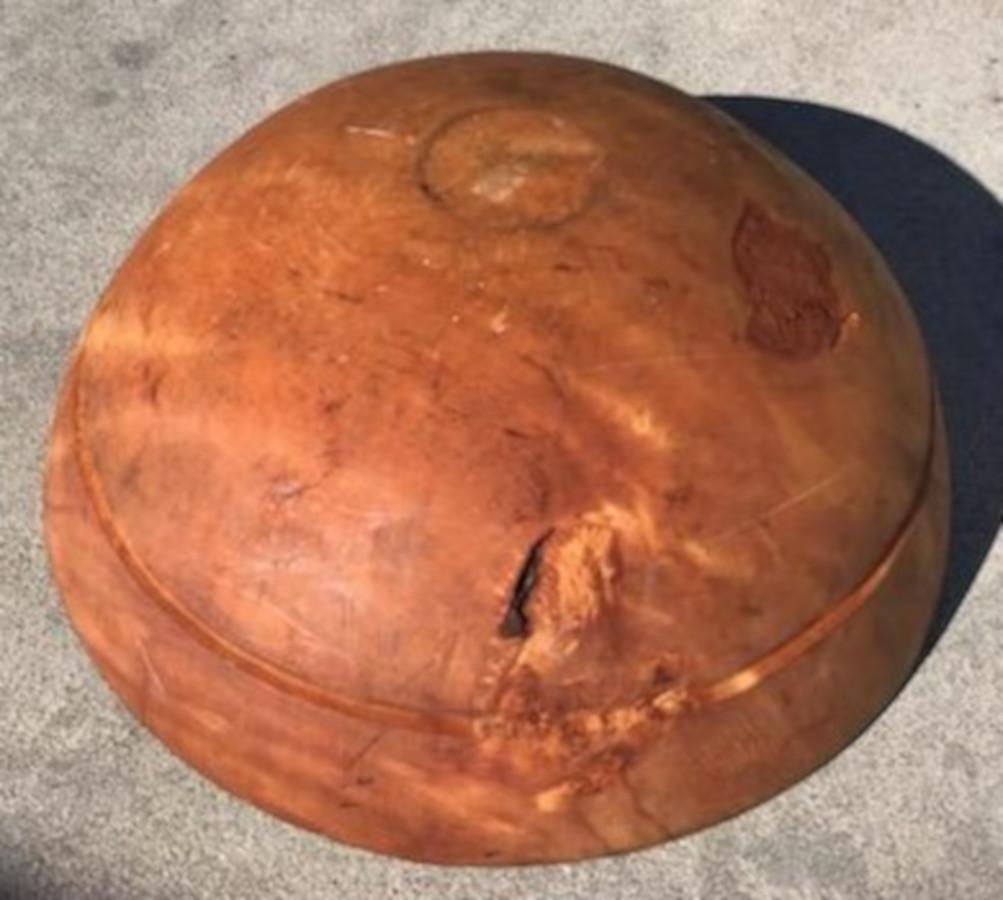 This very large butter bowl was found in New England. It has a burl look to it but it is pine. The condition is very good.