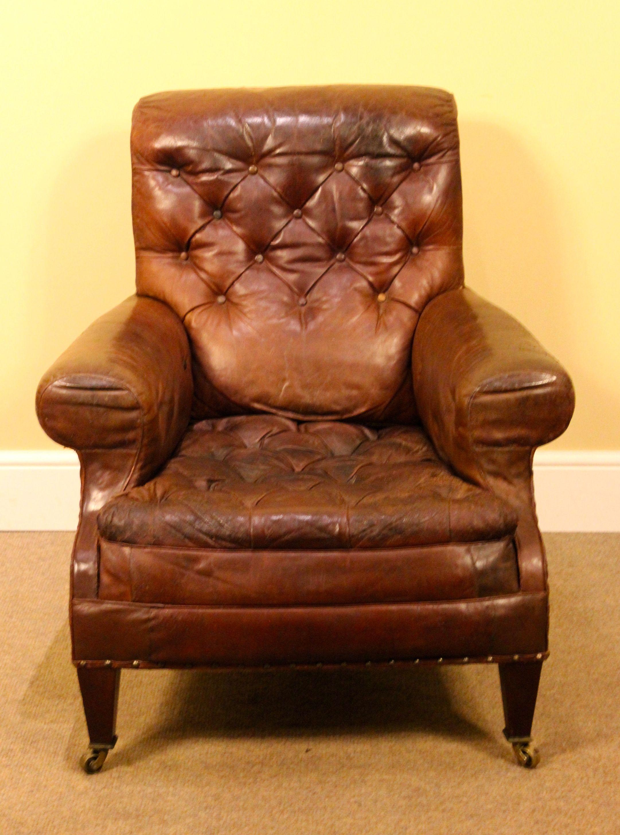 5804
Large 19thc. button back leather armchair
On square tapered legs with brass
Collars & castors. Stamped back legs. c.1890.
Measures: 34”W x 36”H x 34”D
87cm W x 82cm H x 87cm D.

Items can be delivered by independent carrier but please