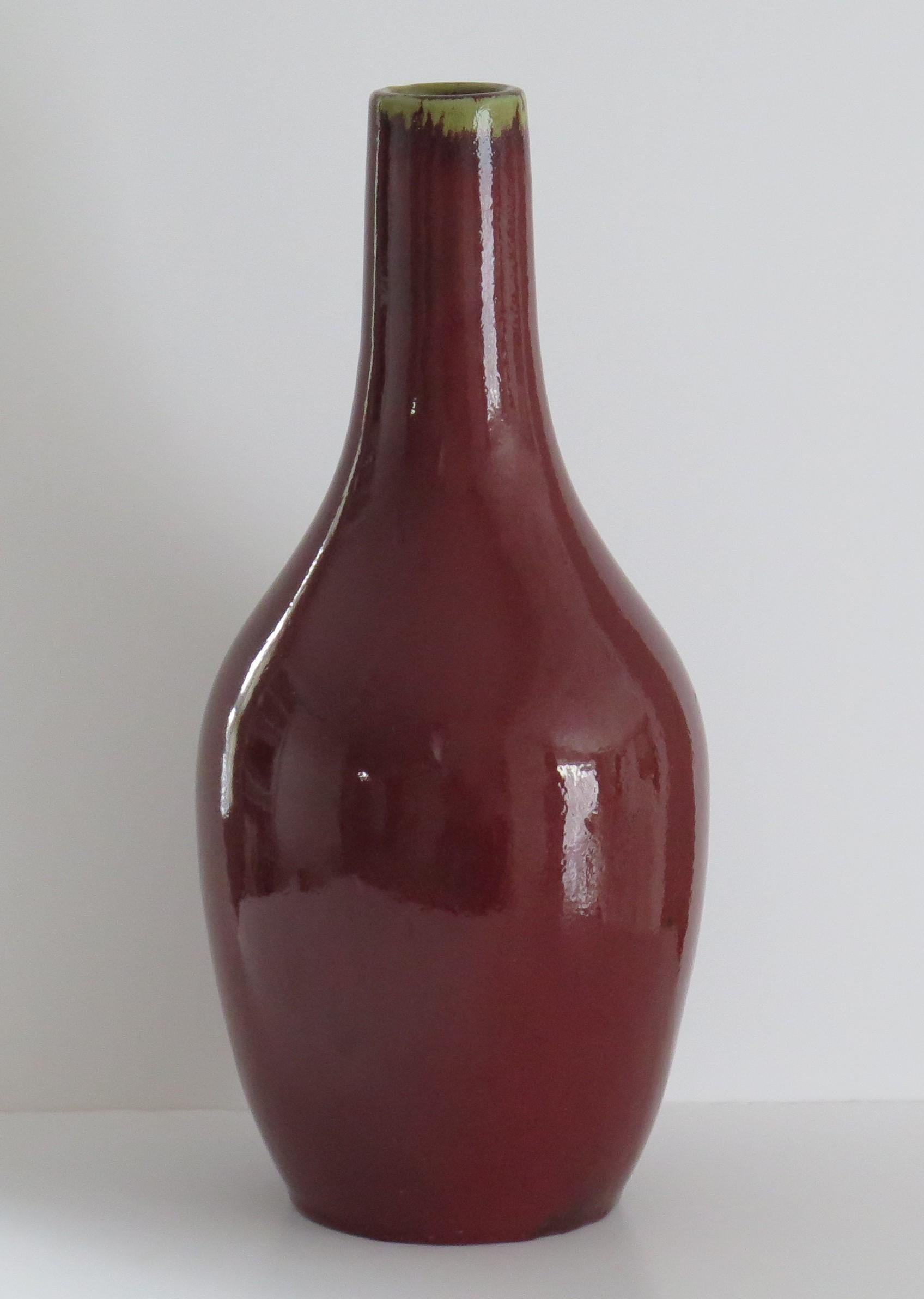 This is a very decorative porcelain Large Chinese Export Bottle Vase or jar with a monochrome ox blood red 