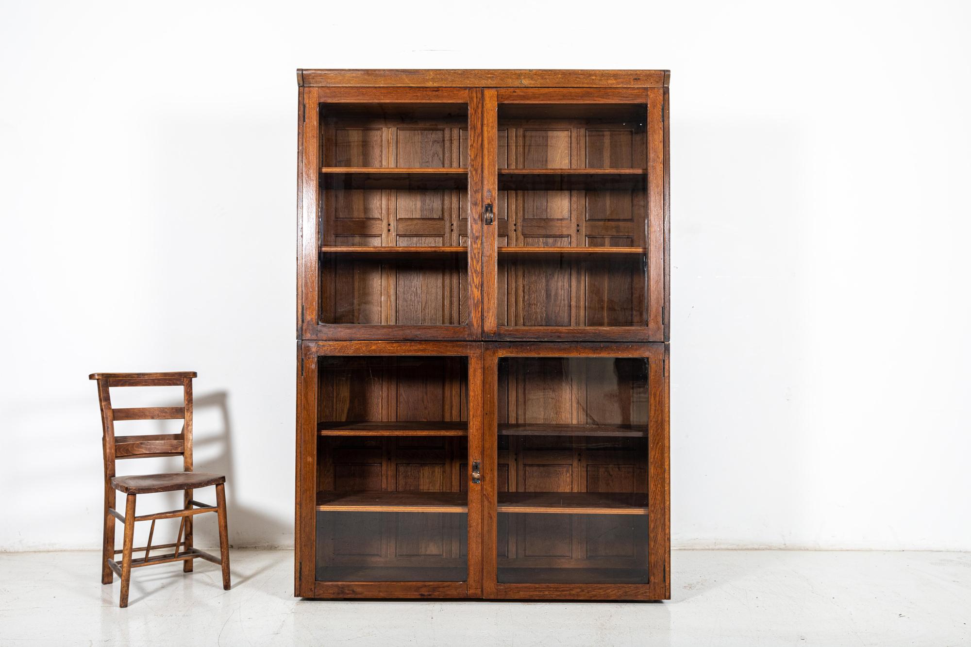 large oak display cabinet with glass doors