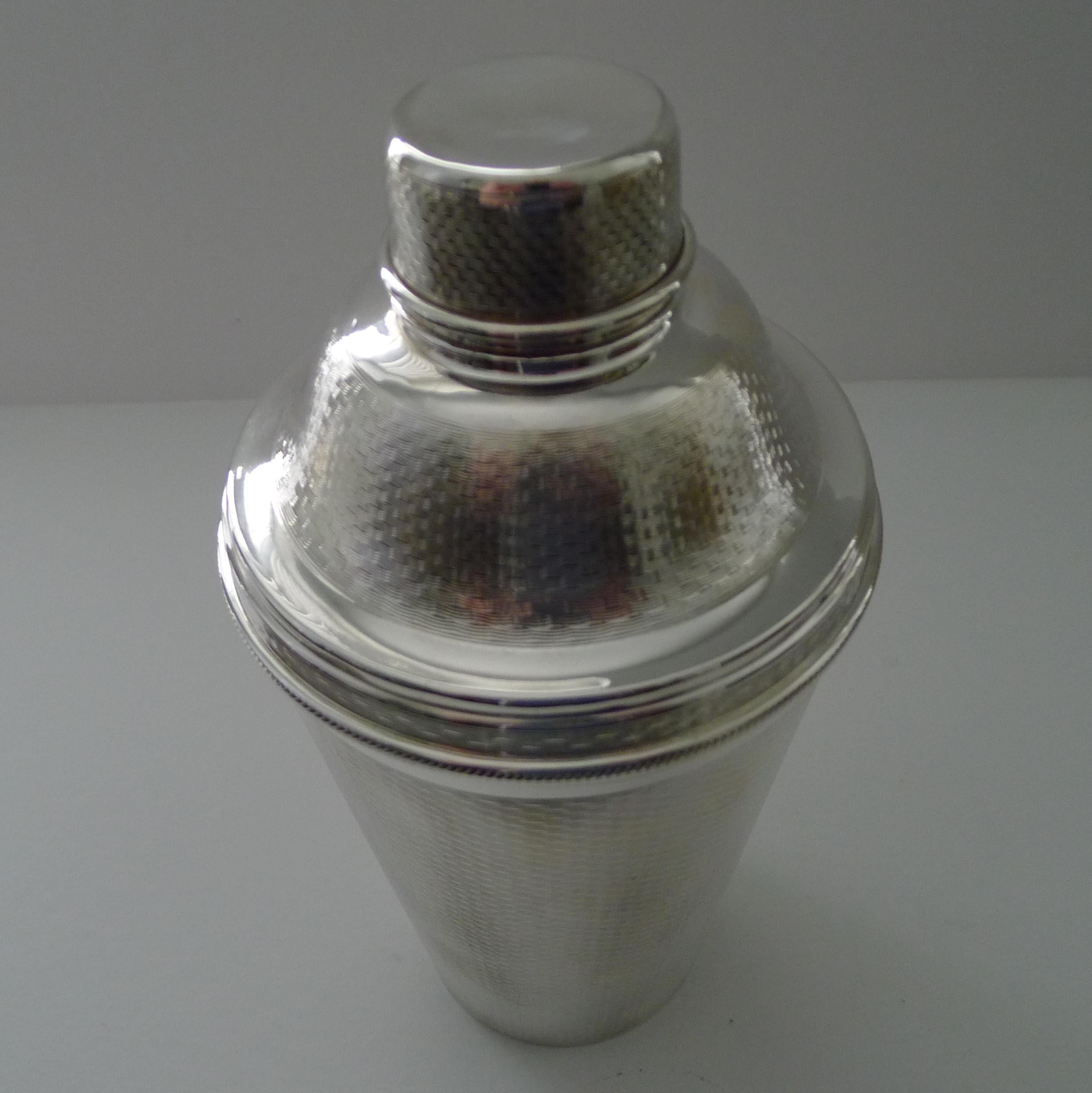 This is a wonderful and most unusual vintage silver plated cocktail Shaker decorated all-over with a continuous engine-turned basket weave decoration; elegantly decorative and tactile. Hard to find in smaller sizes let alone this large 2 1/4 Pint
