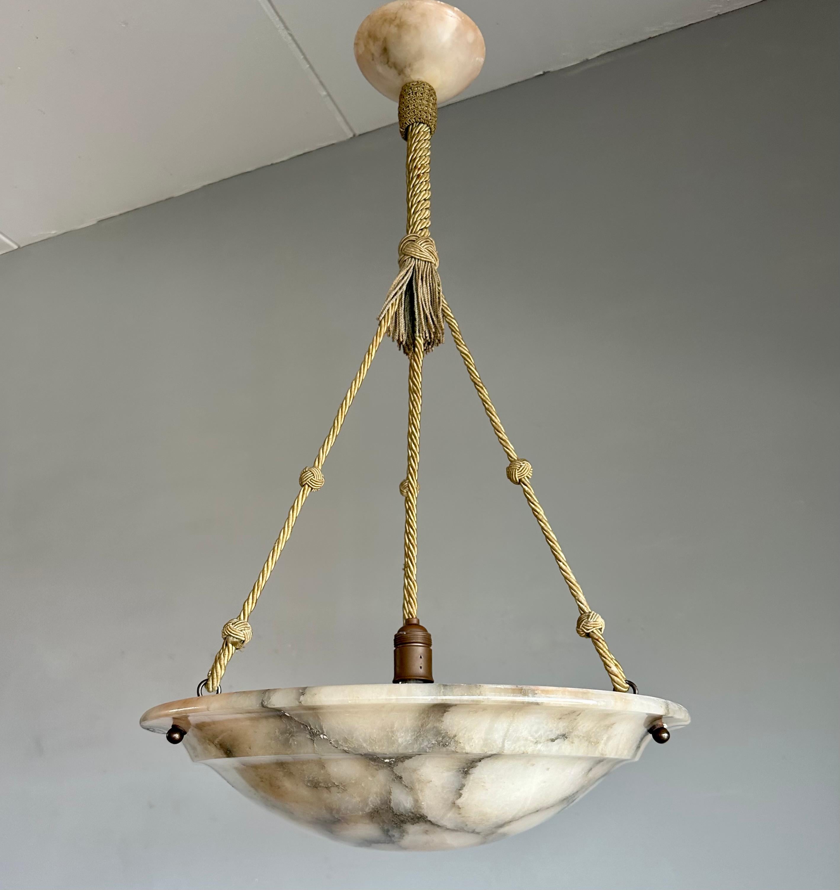 Top class, hand carved and layered alabaster chandelier.

Thanks to its timeless design, aesthetic beauty, large size and superb condition this antique alabaster chandelier is bound to light up both your days and evenings. It is all hand-crafted in