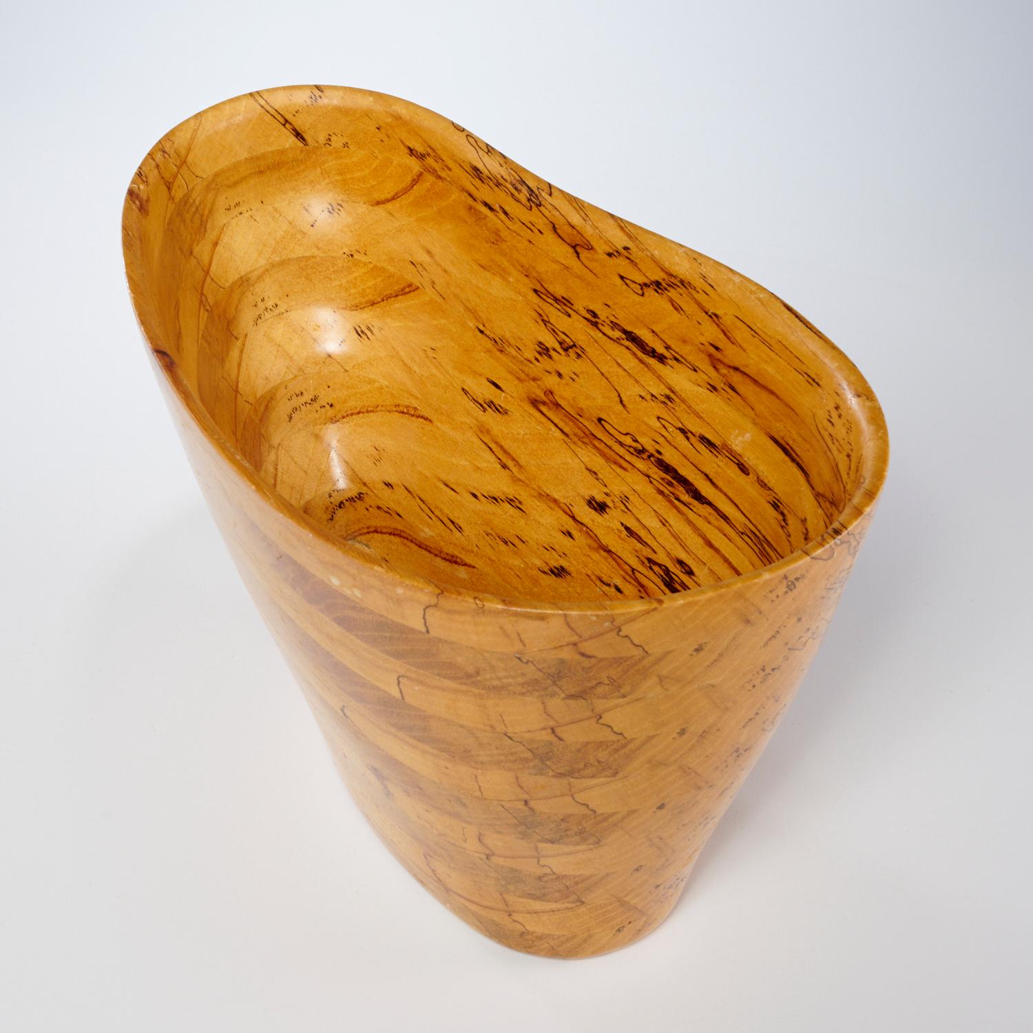 A Peter Petrochko amorphic bowl of layered hickory, signed and dated 2002 underneath. From the 