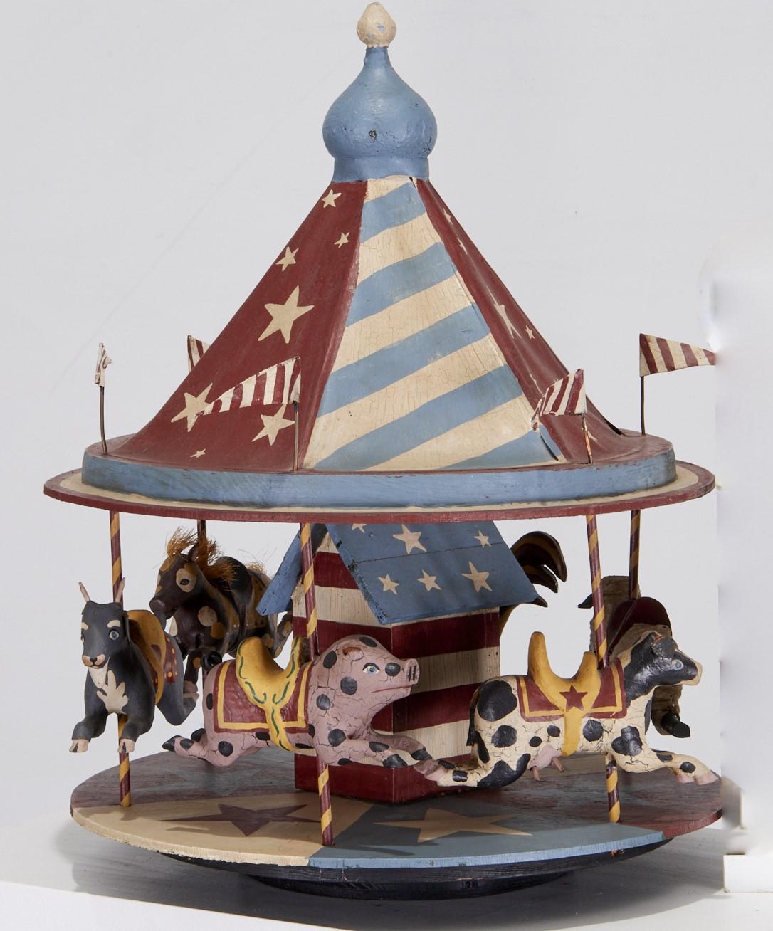 20th c., Large Folk Art carousel with animals on a rotating base.Made of wood and canvas construction, with leather and other accent materials unsigned. The animals depicted are a horse, goat, pig, cow, sheep and rooster. Each animal is colorfully