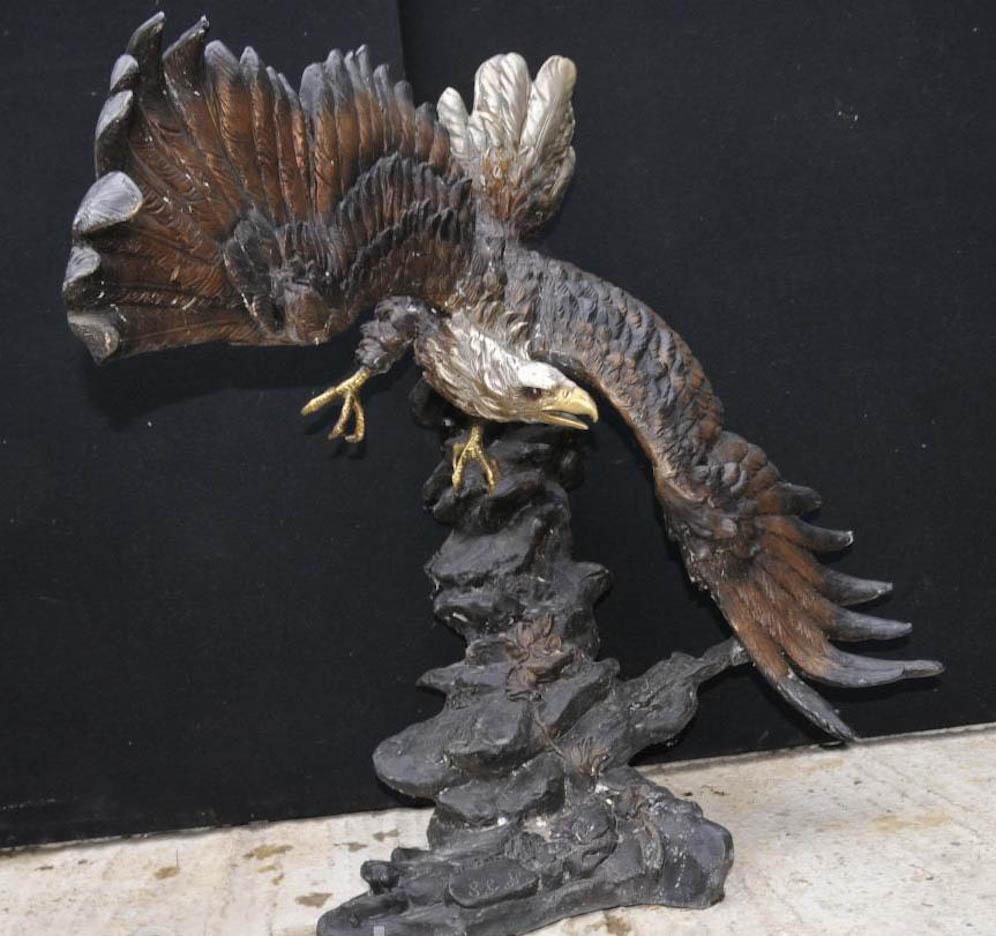 Impressive large 20th century bronze sculpture of an American bald eagle in flight. As you can see the full wing span is shown and the detail to the texture of the feathers is simply outstanding. Superb patina embellished in places with a secondary