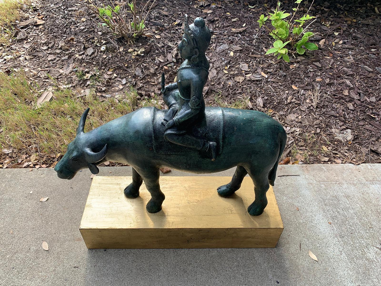 Large 20th Century Stone Water Buffalo with Rider on Custom Gilded Stand In Good Condition For Sale In Atlanta, GA