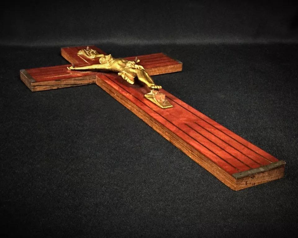 Elevate your collection with this striking 20th-century crucifix, crafted from regule (a type of metal alloy) and wood. This piece is perfect for those with an appreciation for religious or esoteric artifacts. Its beautifully detailed design,