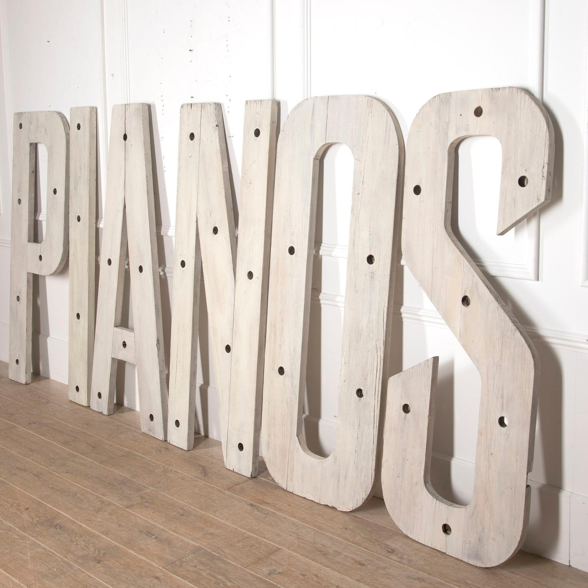 Wonderful set of six large 20th Century French Art Deco letters, spelling PIANOS.
These letters are in an excellent condition, carved from pine and painted for an off-white finish.
They used to adorn an old shop front and have small holes where