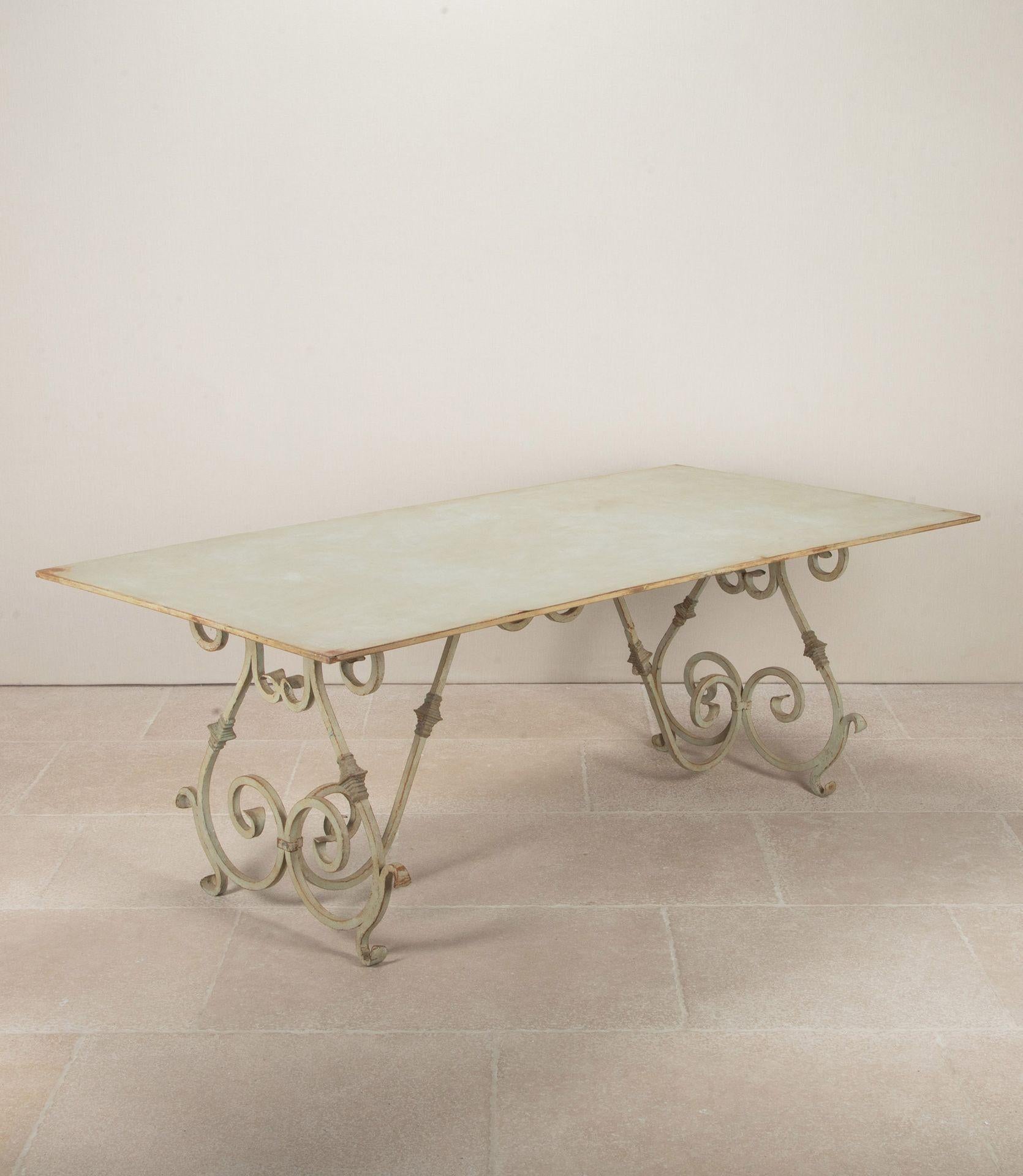 Large early 20th century wrought iron garden table. With old but later soft green painted finish.Circa 1930-40.