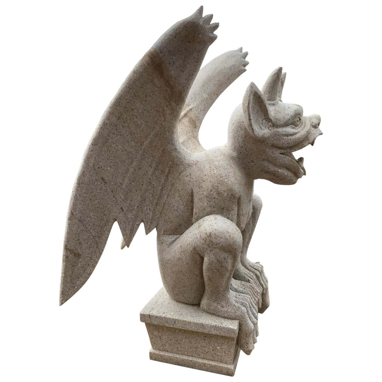 An impressive hand carved large 20th century granite Gargoyle. Very much in the gothic style. Fantastic as decorative sculpture or permanent building fixture.