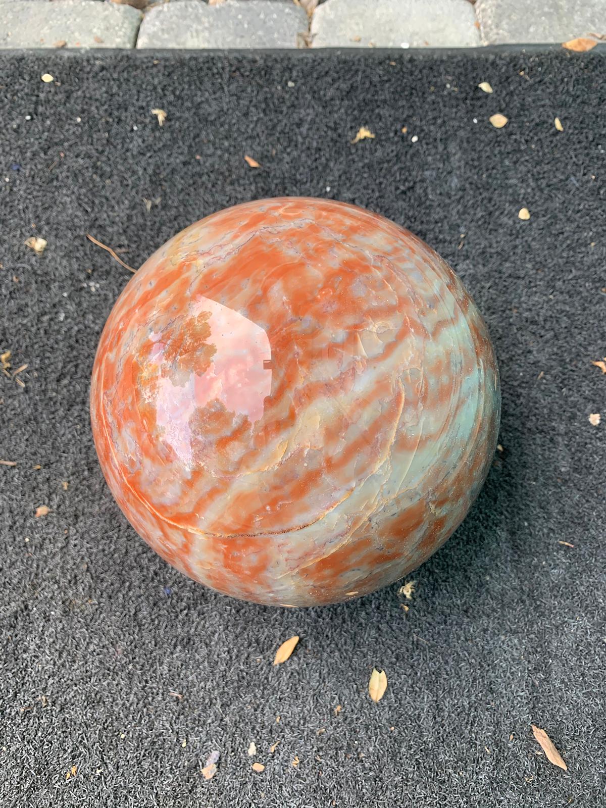 Large 20th century marble Orb, orange, white, grey color veining.