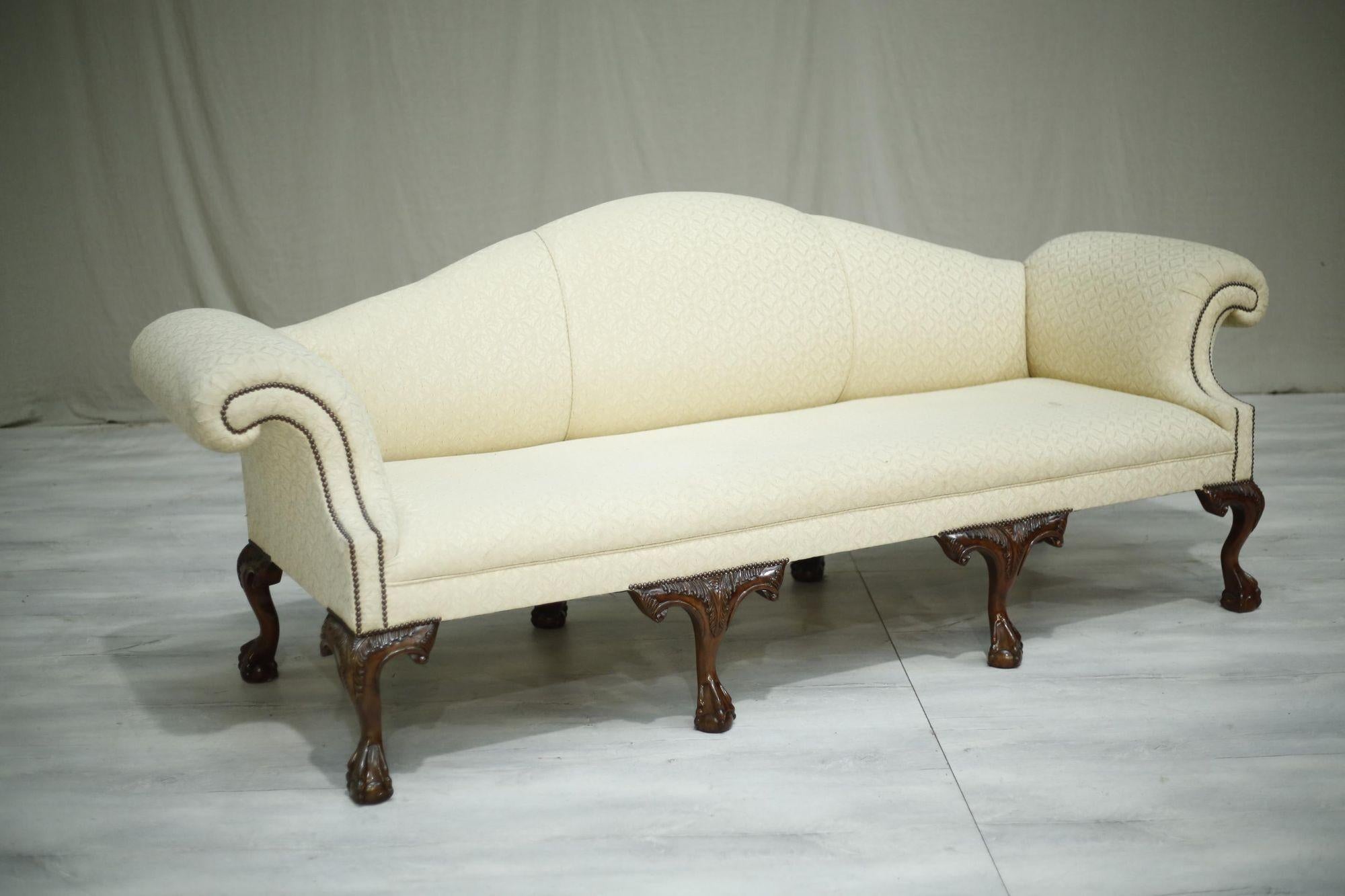 All my armchairs and sofas have been fully restored, springs, legs, padding etc so these will stand the test of time even if used everyday.

This is a very elegant 20th century Georgian style camel backed sofa of huge proportions. It has strong
