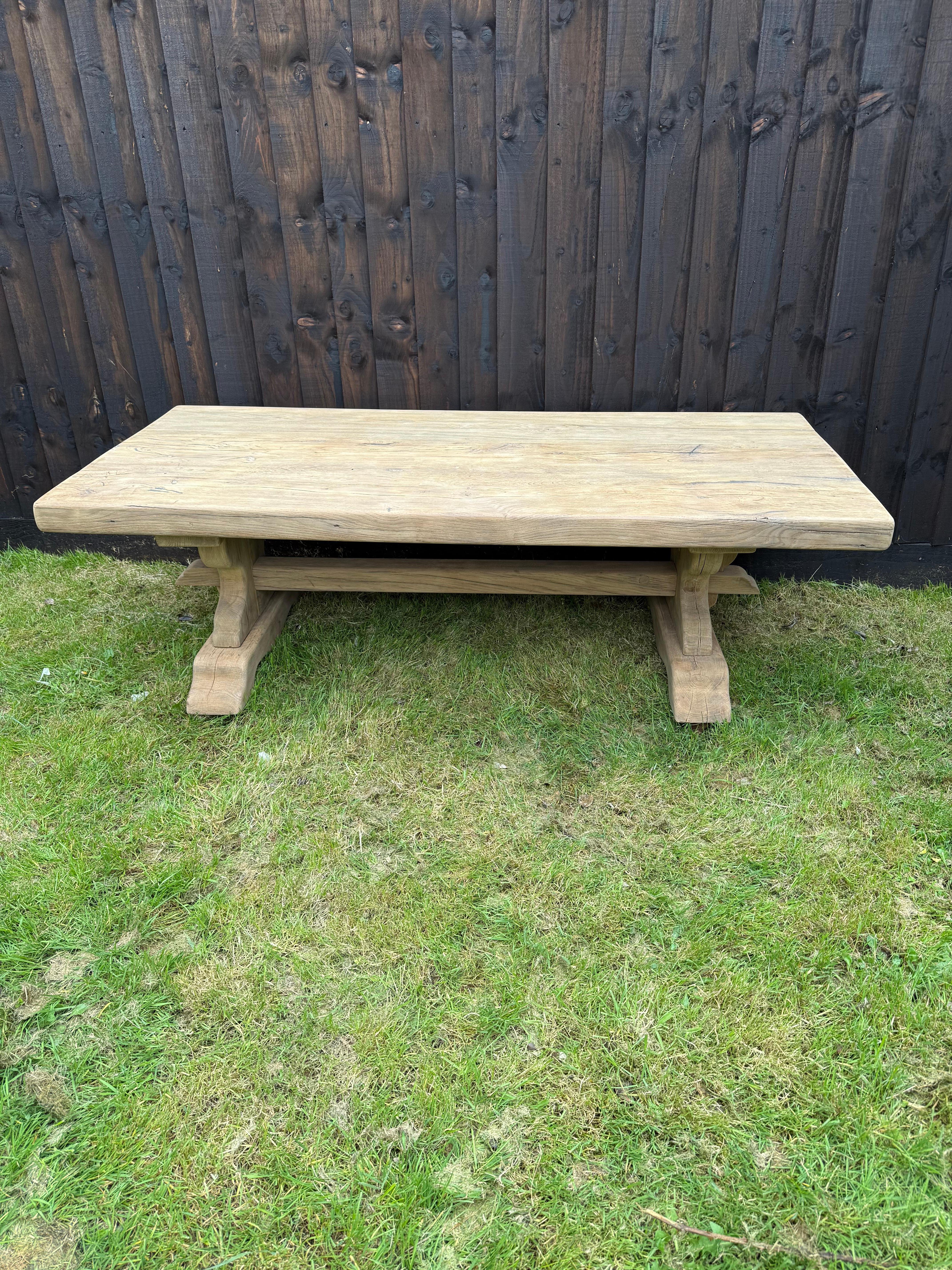 Large early 20th century scrubbed oak refectory style coffee table 

Circa 1902’s constructed from solid oak , the table can float pack for ease of transportation / delivery 

Height 20 inches 
Width 29 inches 
Length 63 inches 

The whole piece can
