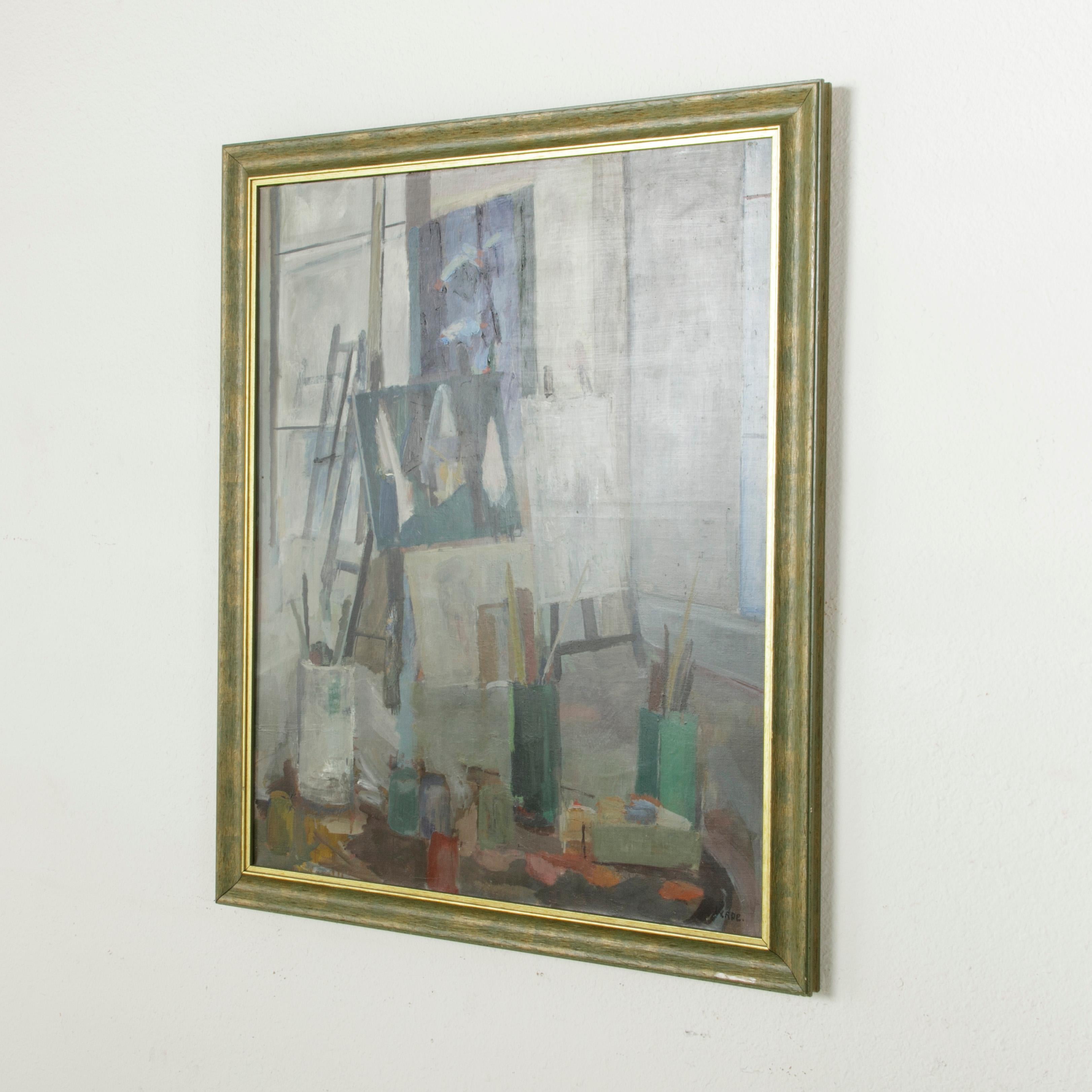 This large scale French oil on canvas painting is signed by the artist, Verde. Displayed on the canvas is a cubist style interpretation of the artist's studio. Represented are the brushes, easels, and half-finished canvases of the artist with large