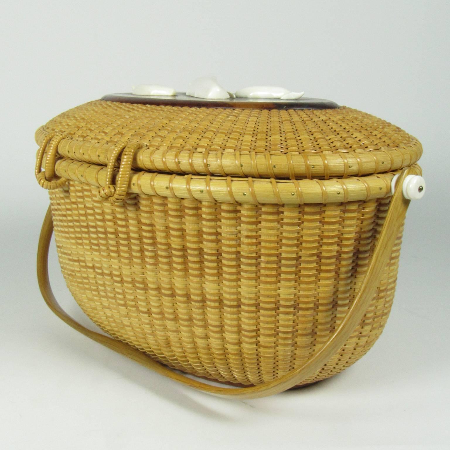 Susan Chase Ottison very large oval swing handled Nantucket basket adorned with a carved bone female whale (cow) and two calves. Signed and dated on bottom 