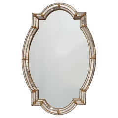 Large 20th century Venetian style trapezoidal brass and mosaic mirror