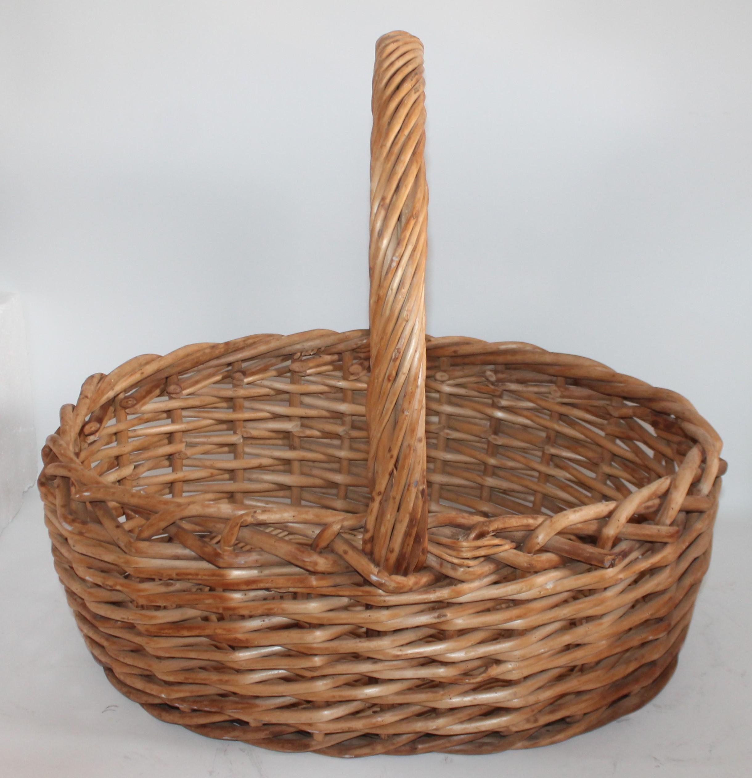 This large rustic basket was found in the mid west and is in fine condition. It is unfinished or natural finish. The condition is very good.