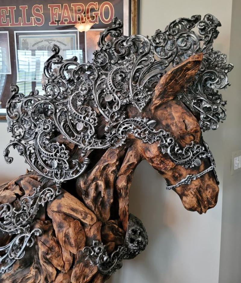 Large 21st Century Wooden Horse Sculpture with Aluminum Mane by Michael Amini. This large scale sculpture is absolutely stunning! Beautiful lines of the wood paired with incredible aluminum scrolled decor make this a conversation piece. Measures: