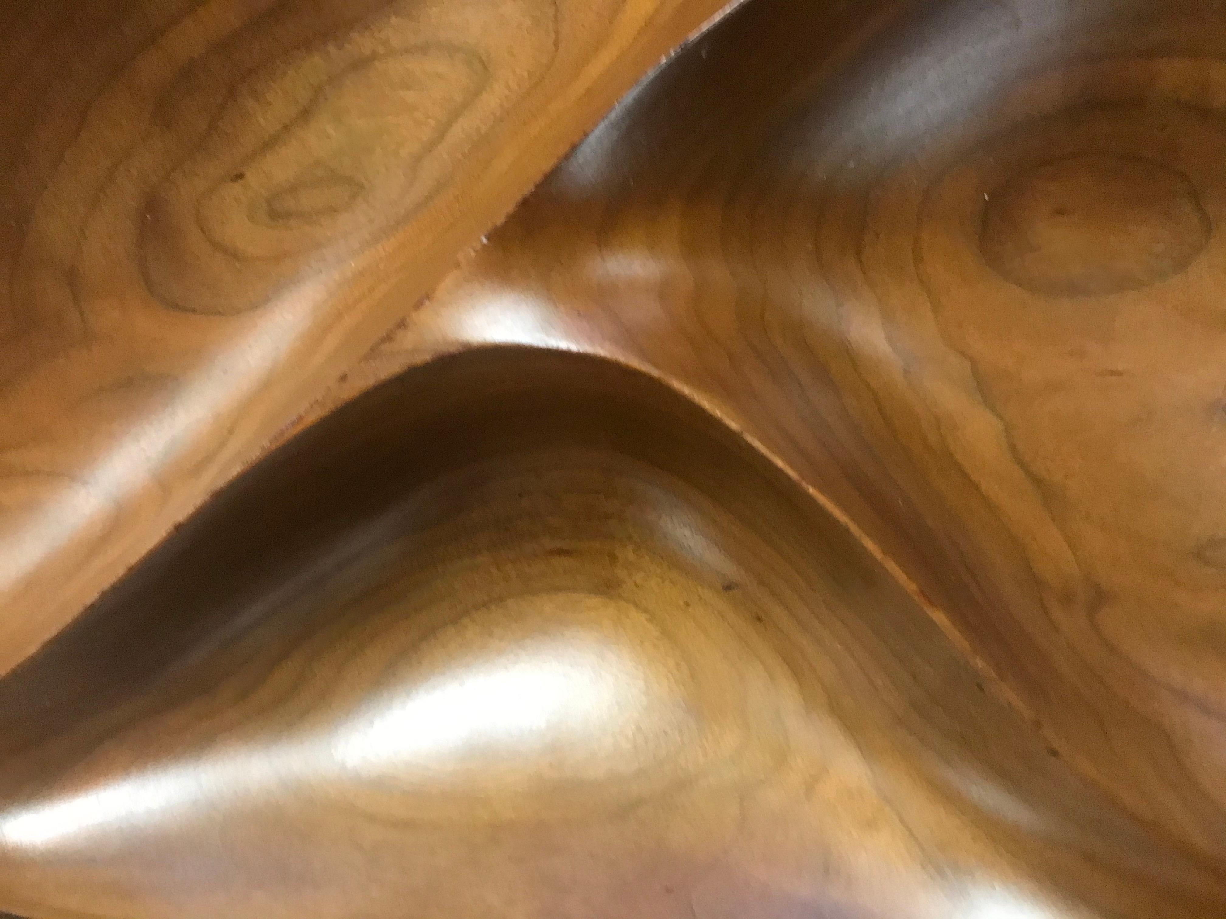 An exquisitely carved compartmental freeform bowl by Emil Milan (1922-1985), executed in richly grained walnut. Rich patina throughout. Signed to the underside, 