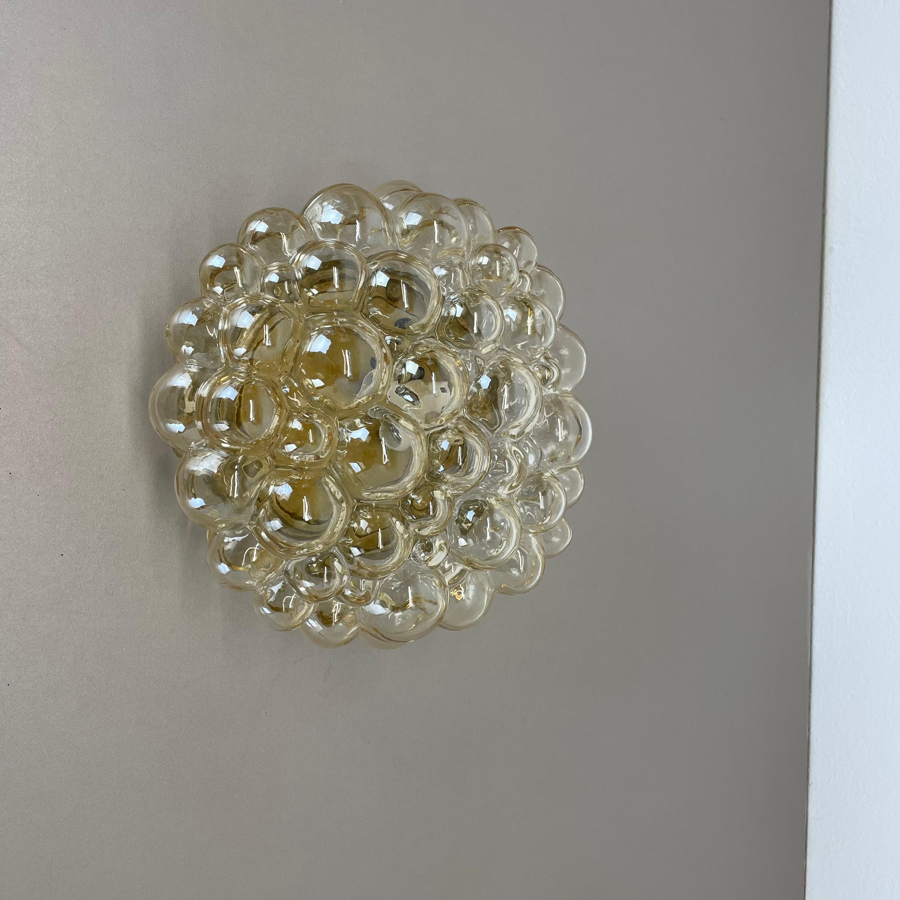 Article:

wall light  ceiling light



Producer: 

Glashütte Limburg, Germany


Design:

Helena Tynell


Origin: 

Germany


Age: 

1960s





This fantastic glass wall  ceiling light was designed by Helena Tynell and produced in 1960s in Germany by