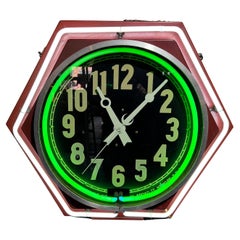 Grand 26" x  Horloge néon hexagonale bicolore Art déco 26" par  EXPOSITION DE NEON INC.