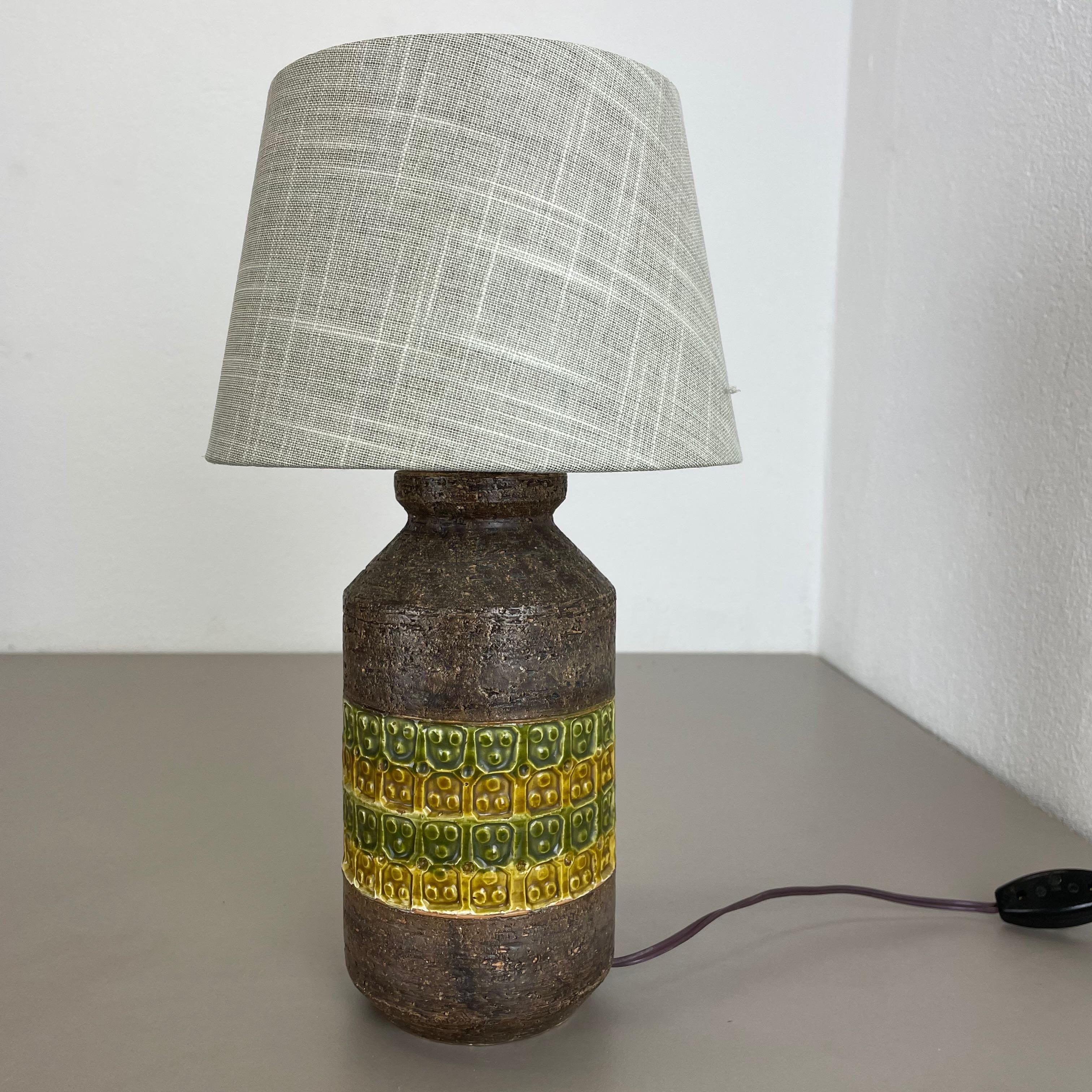 Article:

Ceramic table light base


Producer:

BITOSSI, Italy



Decade:

1970s



This original vintage ceramic Pottery light base was produced by BITOSSI in Italy
in the 1970s. It is made of solid pottery and has coloration in