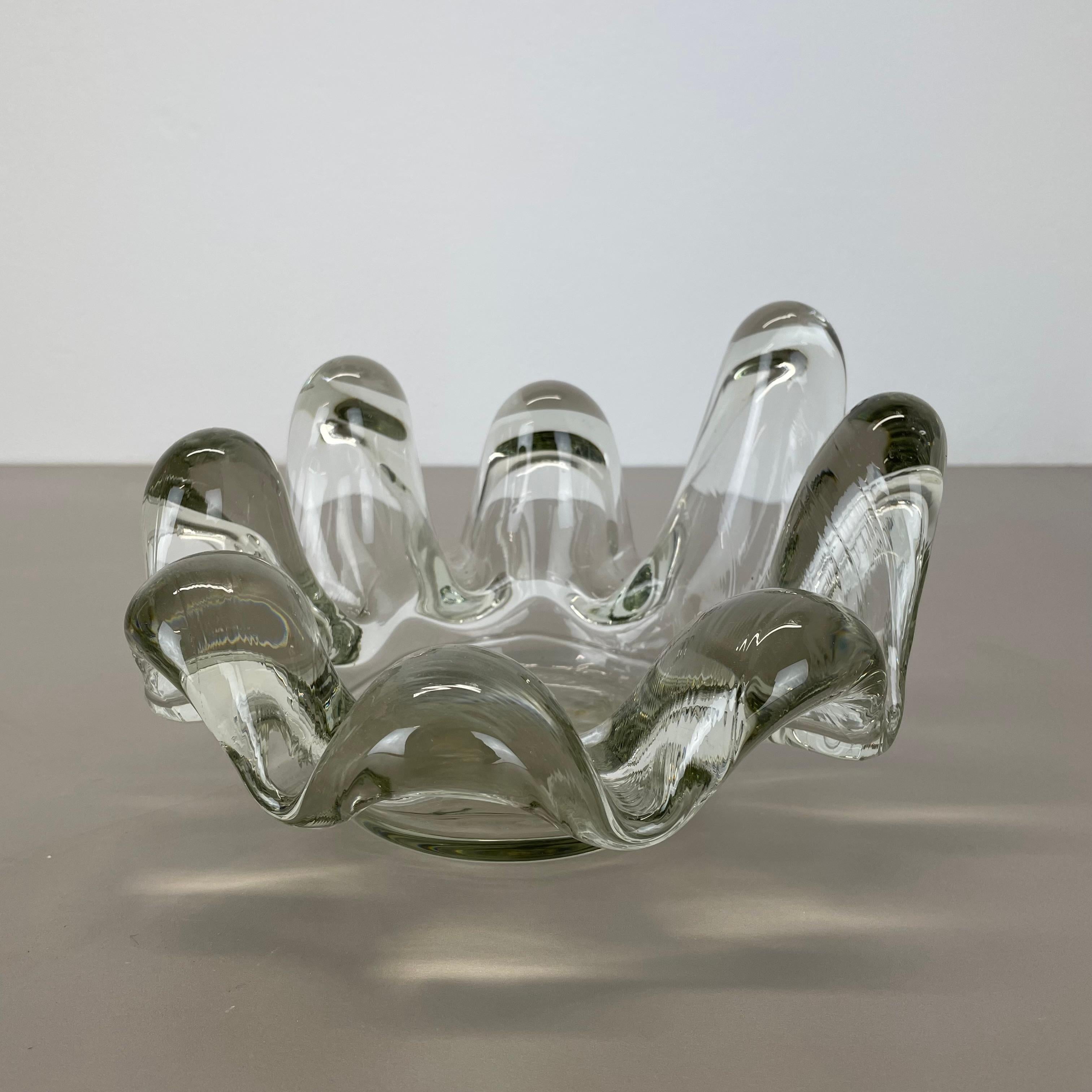 Article:

glass bowl shell element


Origin:

France


Decade:

1970s



This original vintage glass bowl element was produced in the 1970s in France. It is made of solid very heavy and has a fantastic brutalist organic form. The vibrant clear color