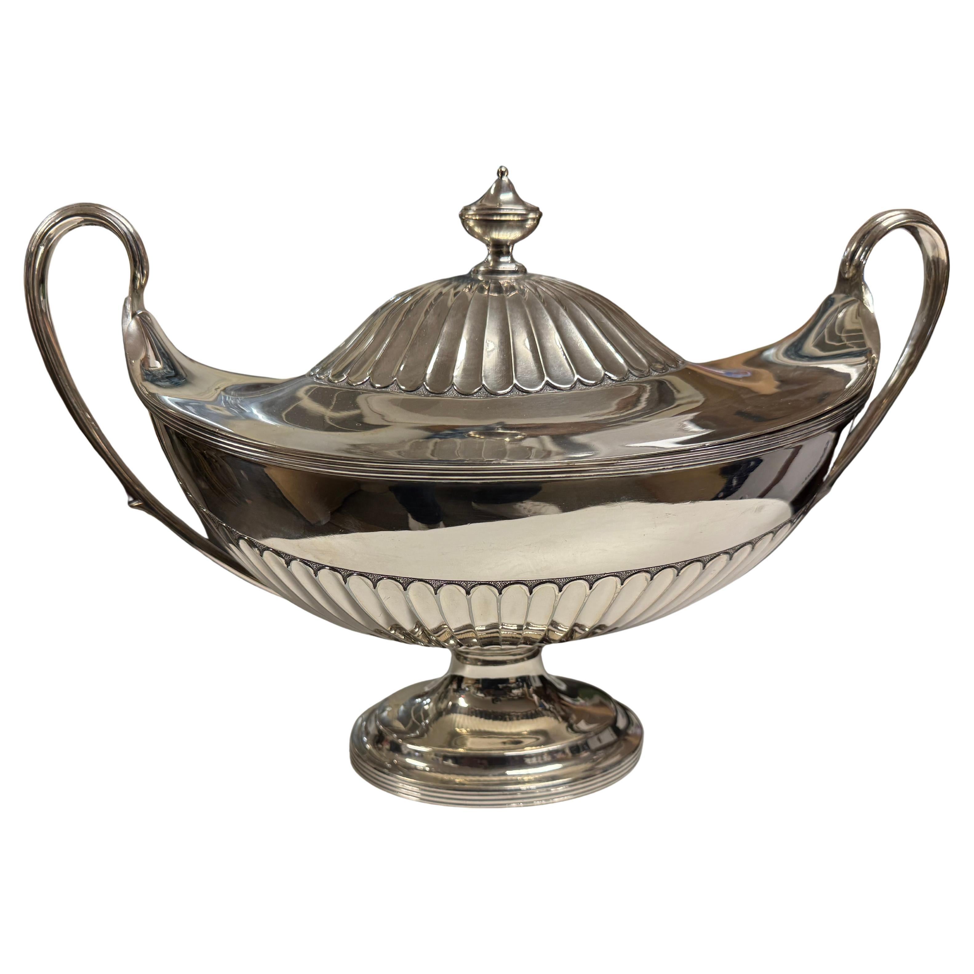 This is a fabulously crafted sterling silver soup tureen/urn.
It weighs 3.2lbs.
It hails from Europe and bears hallmarks on the underside. 